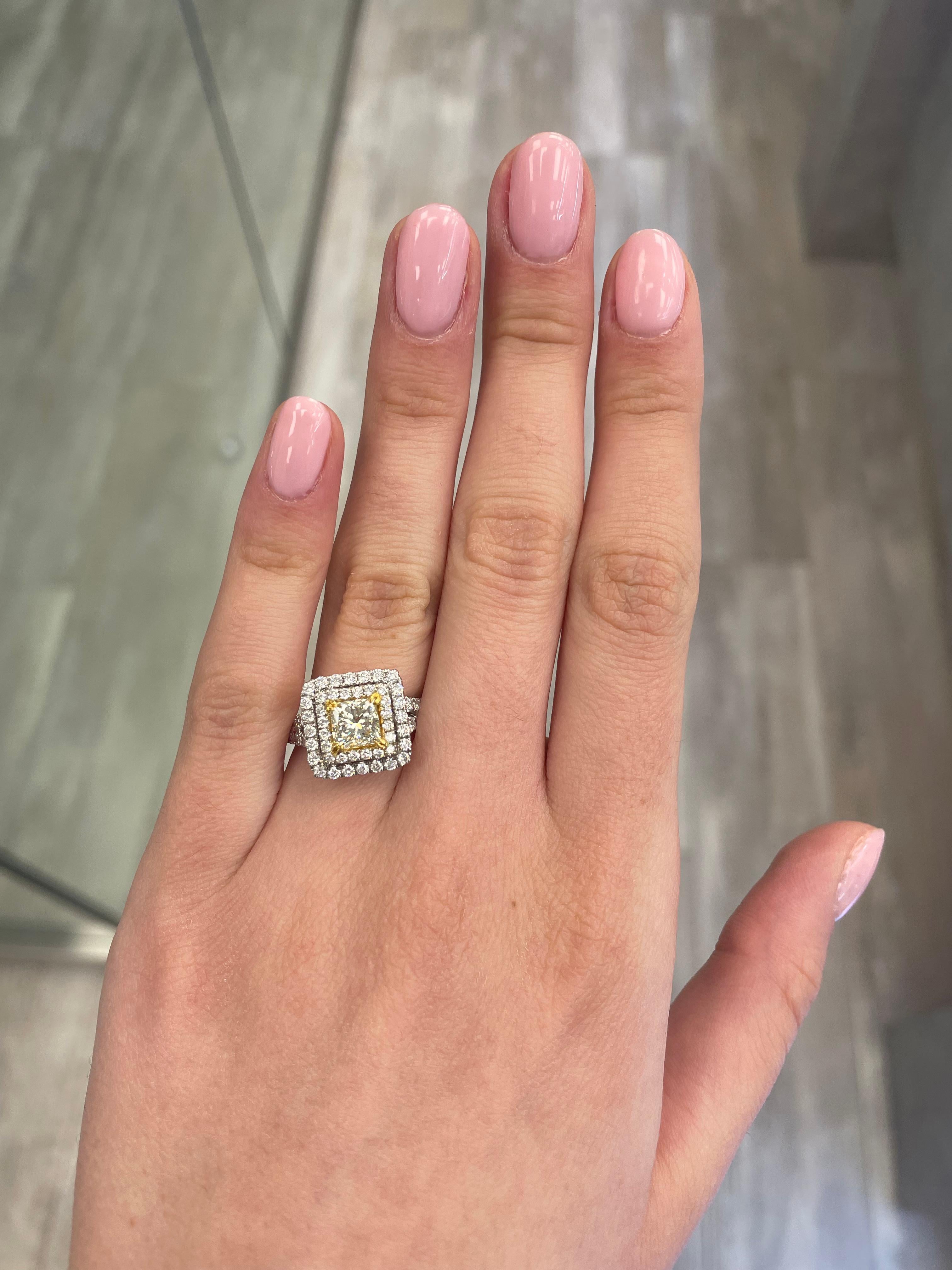 Stunning modern EGL certified yellow diamond double halo ring, two-tone 18k yellow and white gold, split shank. By Alexander Beverly Hills
2.26 carats total diamond weight.
1.53 carat princess cut Light Yellow color and VS1 clarity diamond, EGL