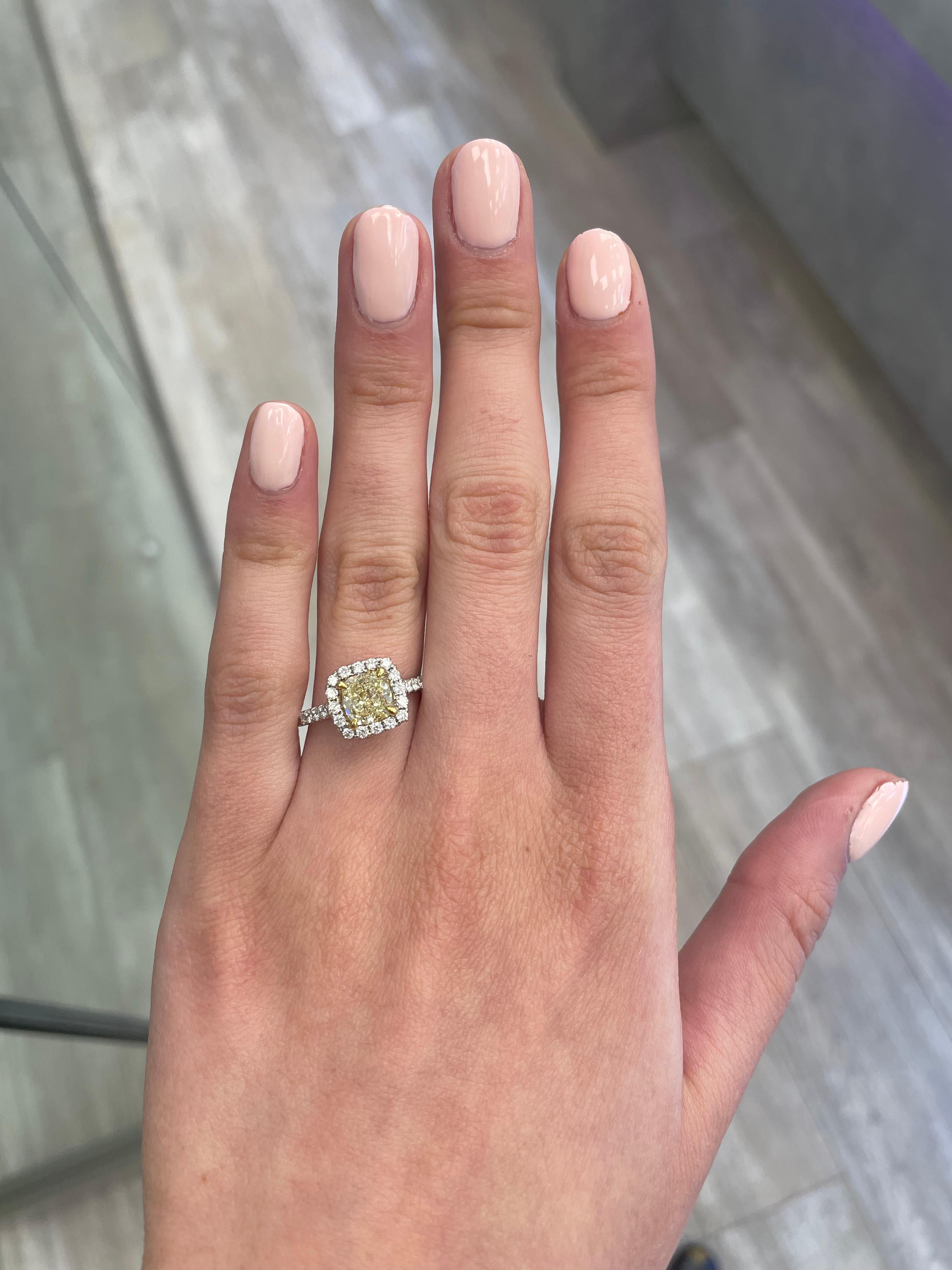 Stunning modern EGL certified yellow diamond with halo ring, two-tone 18k yellow and white gold. By Alexander Beverly Hills
2.31 carats total diamond weight.
1.72 carat cushion cut Fancy Yellow color and VS1 clarity diamond, EGL graded. Complimented
