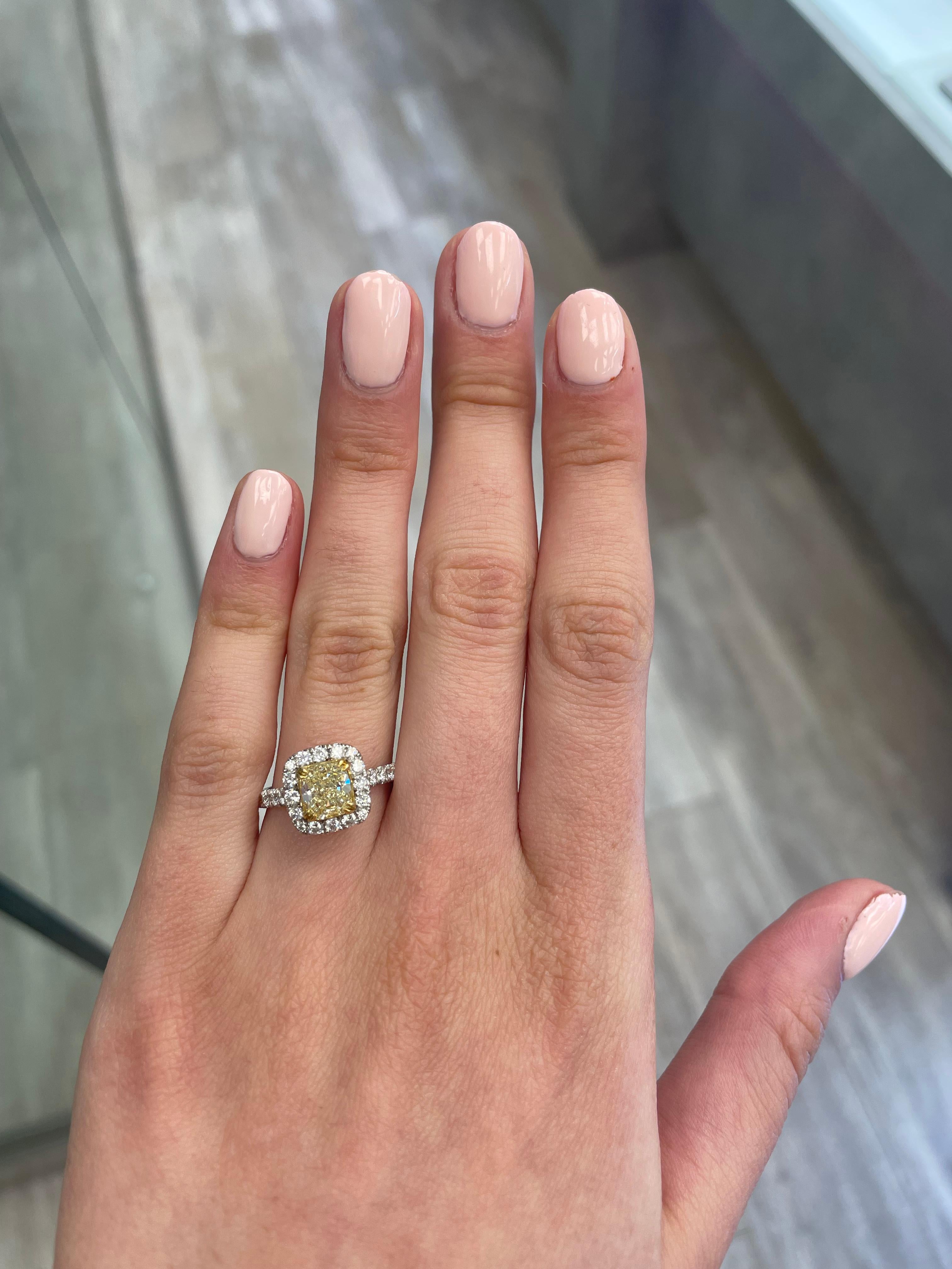 Stunning modern EGL certified yellow diamond with halo ring, two-tone 18k yellow and white gold. By Alexander Beverly Hills
2.33 carats total diamond weight.
1.27 carat cushion cut Fancy Yellow color and VS1 clarity diamond, EGL graded. Complimented