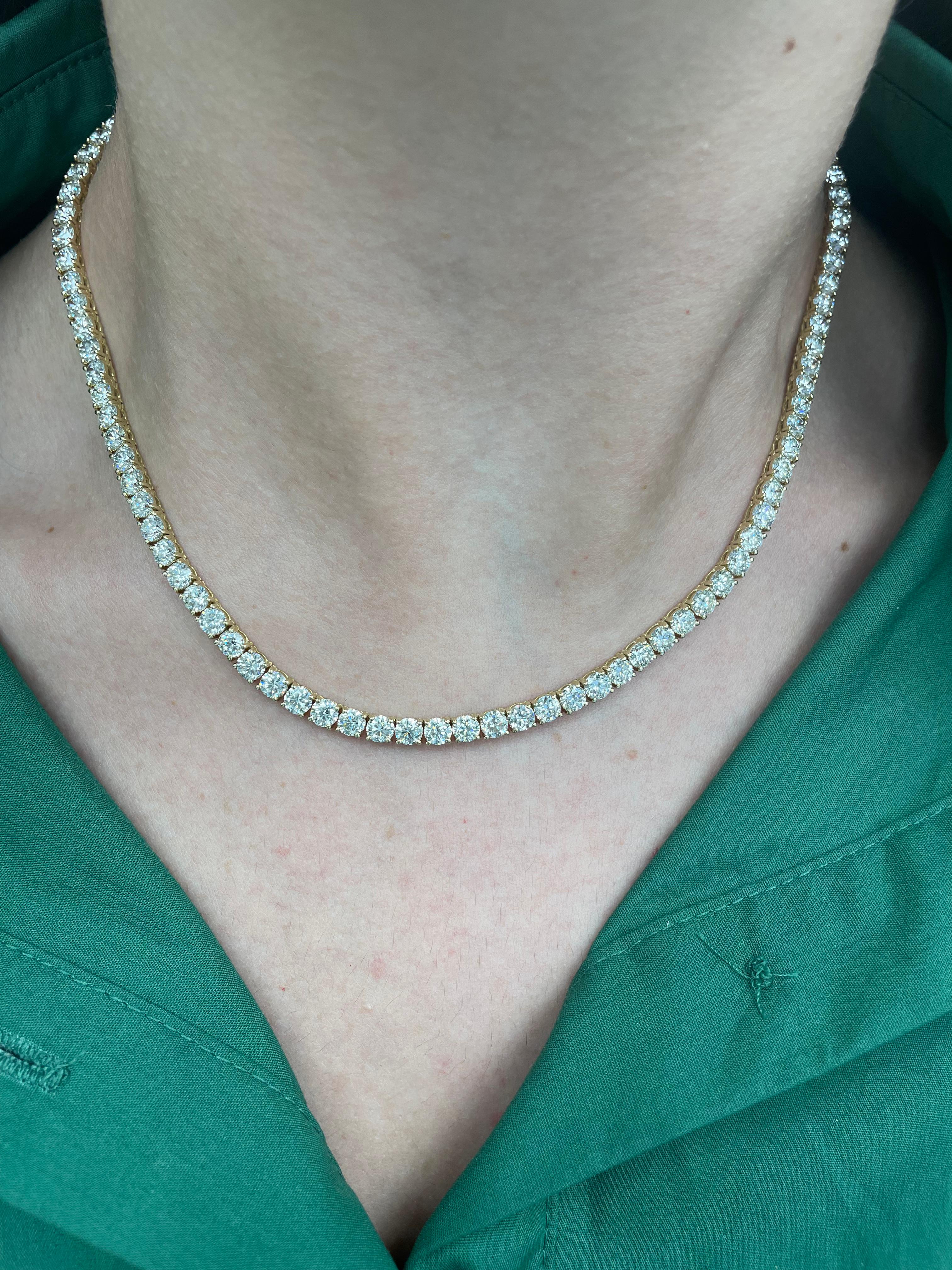 Beautiful modern diamond tennis necklace. Created by Alexander Beverly Hills.
100 round brilliant diamonds, 24.56 carats. Approximately H/I color and VS clarity. 18k yellow gold, 26.19 grams, 16.5in.
Accommodated with an up to date appraisal by a