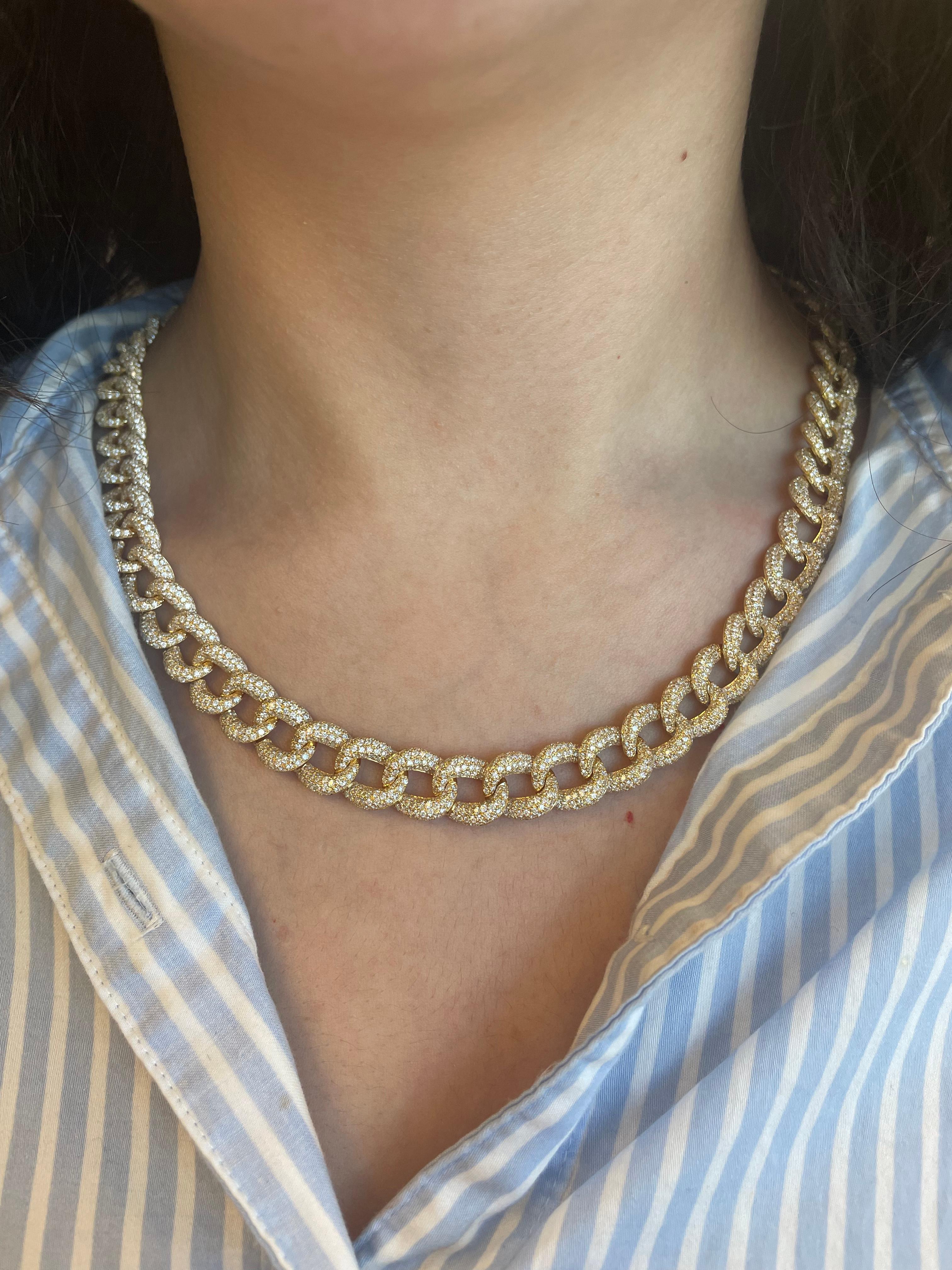 Modern diamond cuban link Necklace. High jewelry by Alexander Beverly Hills.
3584 round brilliant diamonds, 25.07 carats total. Approximately G/H color and VS2/SI1 clarity. 18k yellow gold, 123.98 grams, and 12mm width.
Accommodated with an
