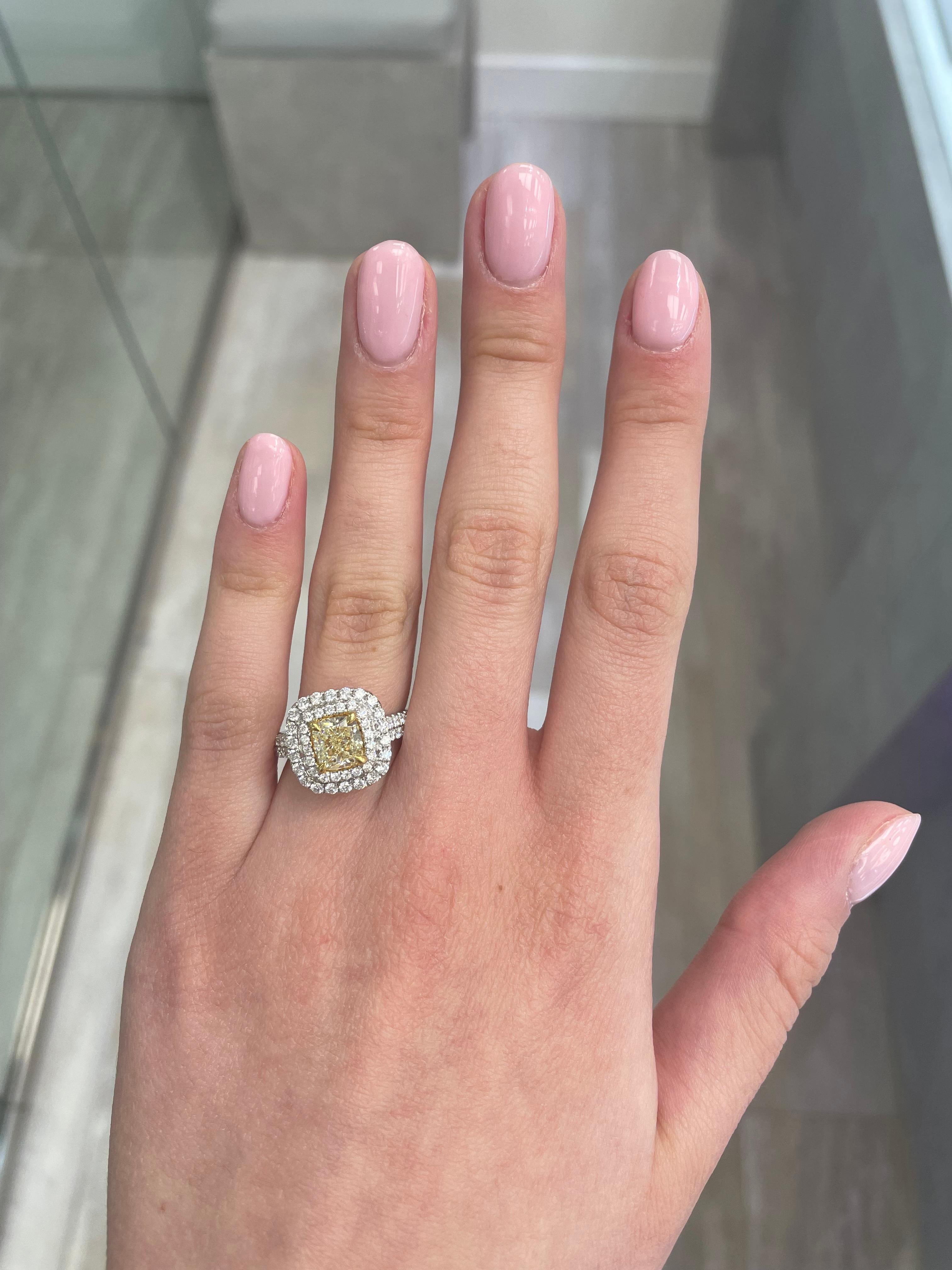 Stunning modern EGL certified yellow diamond double halo ring, two-tone 18k yellow and white gold. By Alexander Beverly Hills
2.66 carats total diamond weight.
1.50 carat cushion cut Fancy Intense Yellow color and VS2 clarity diamond, EGL graded in