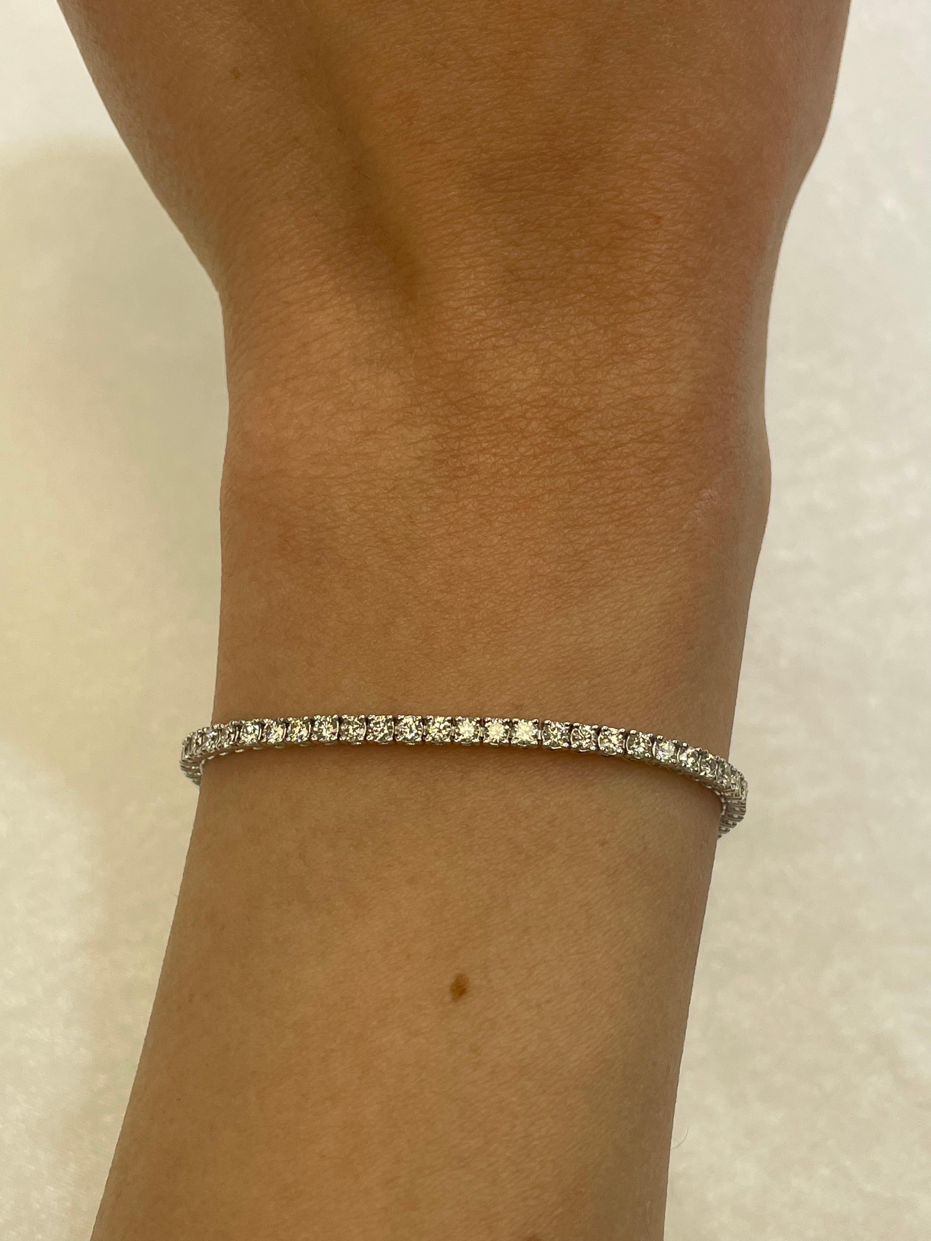 Exquisite and timeless diamonds tennis bracelet, by Alexander Beverly Hills.
74 round brilliant diamonds, 2.71 carats total. Approximately G/H color and VS clarity. Four prong set in 14k white gold, 6.84 grams, 7 inches. 
Accommodated with an up to