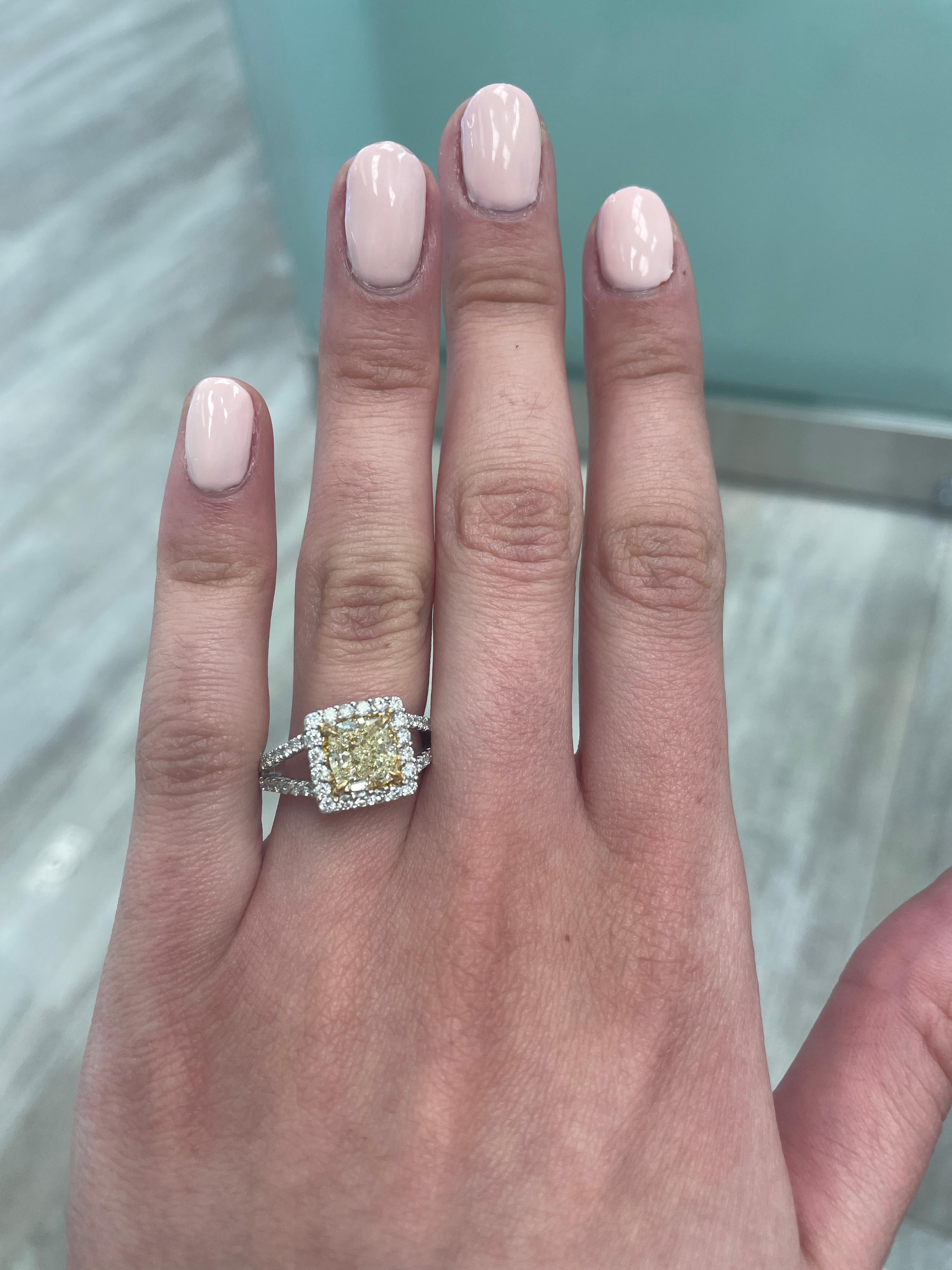 Stunning modern EGL certified yellow diamond with halo ring, two-tone 18k yellow and white gold. By Alexander Beverly Hills
2.72 carats total diamond weight.
2.01 carat cushion cut Fancy Yellow color and SI1 clarity diamond, EGL graded. Complimented