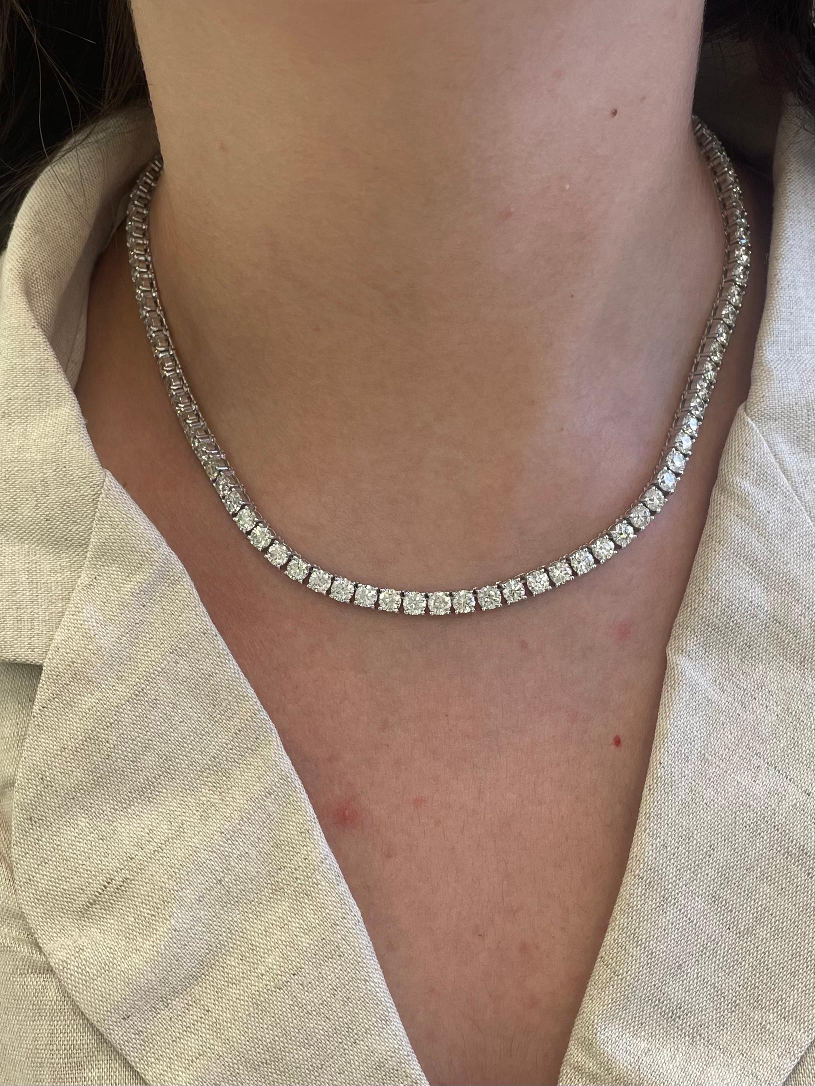 Beautiful and classic diamond tennis riviera necklace, by Alexander Beverly Hills.
91 round brilliant diamonds, 27.74. Approximately H-J color and VS2/SI1 clarity. 18k white gold, 45.59 grams, 16in.
Accommodated with an up-to-date digital appraisal