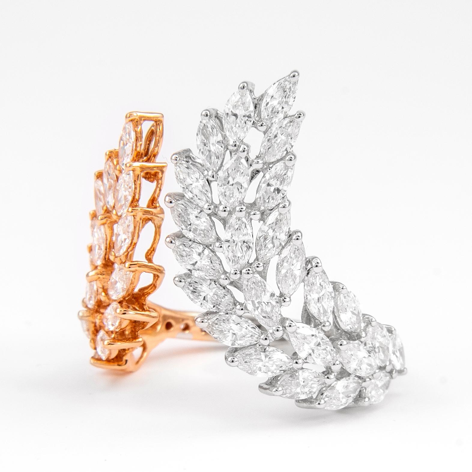 Stunning modern and unique feather motif two-tone diamond ring. Half of the ring in yellow gold and the other half white gold, open shank. By Alexander of Beverly Hills.
48 marques and round brilliant diamonds, 2.80 carats. Approximately F/G color