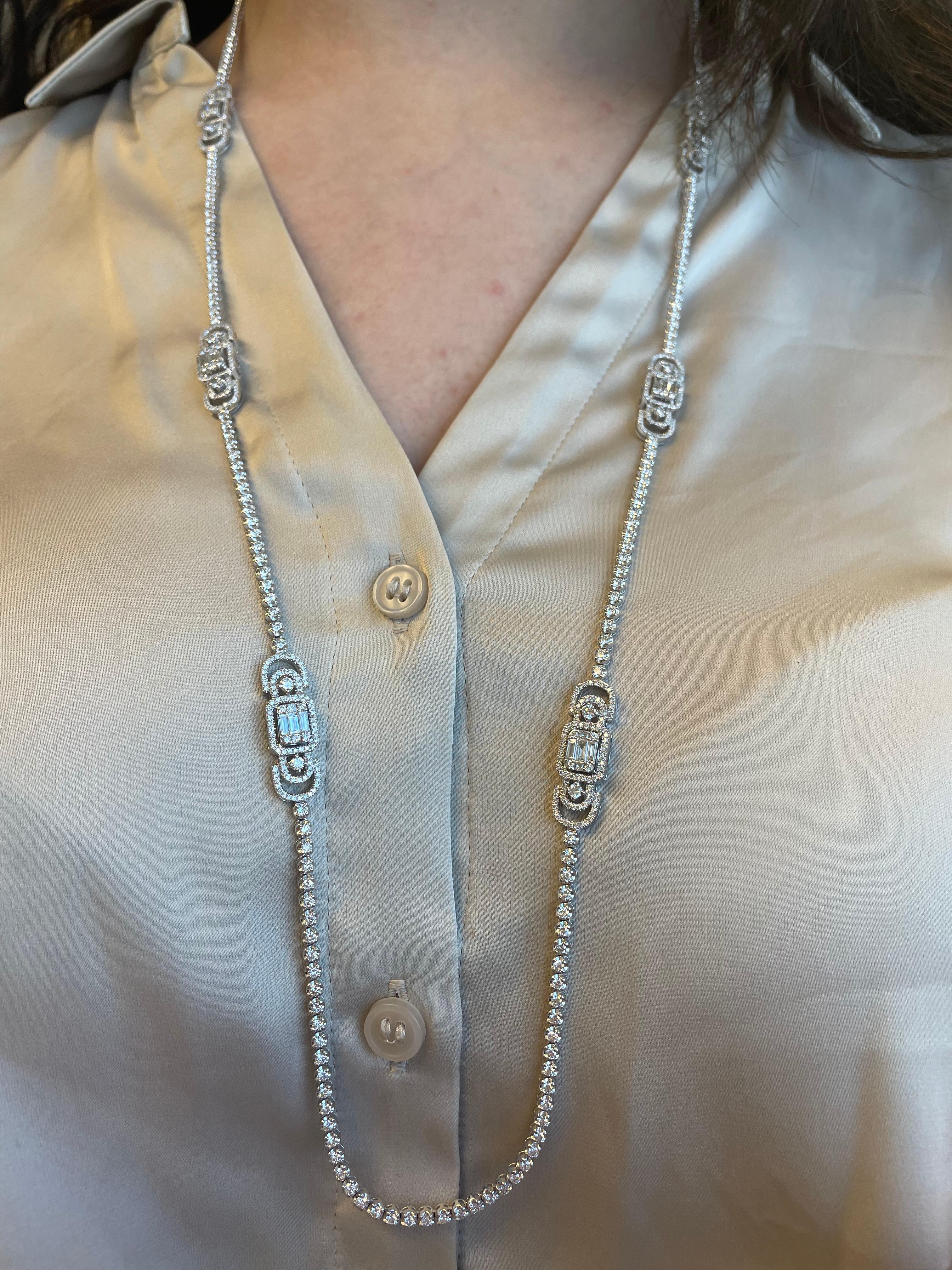 Exquisite and timeless diamonds tennis necklace, 31 inches. Illusion set to look like emerald cut diamonds. By Alexander Beverly Hills.
815 round, princess, and baguette shape diamonds, 9.04 carats total. Approximately G/H color and VS clarity. 18k