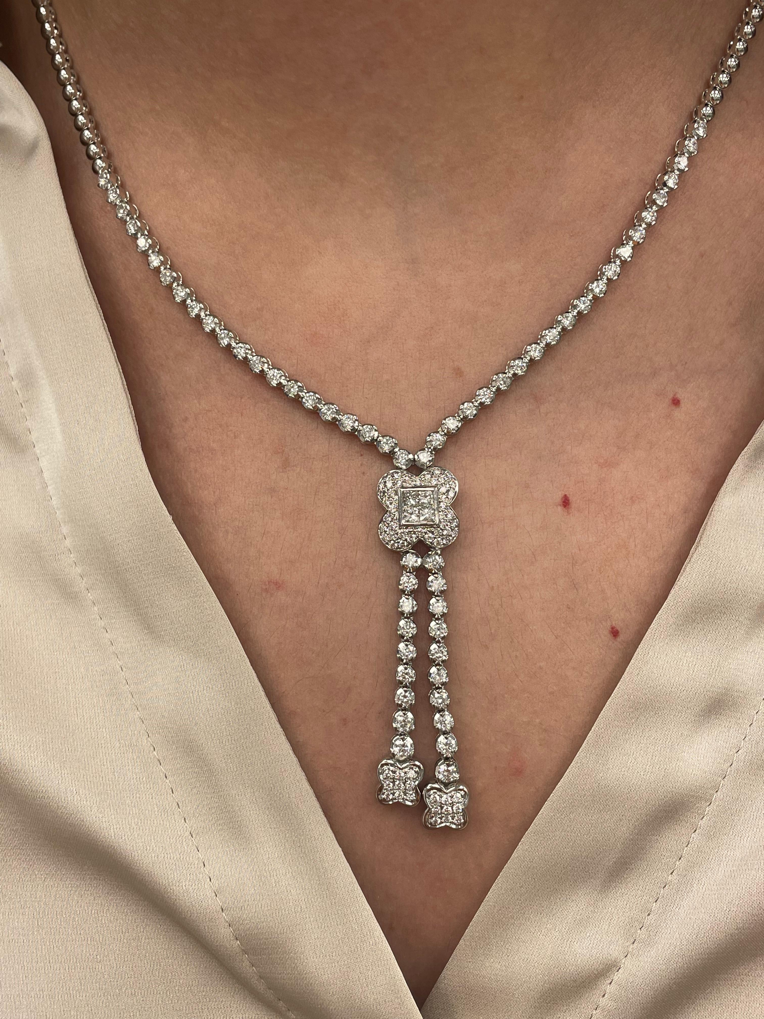 Exquisite diamond bow motif drop necklace, by Alexander Beverly Hills.
*Front half is with diamonds and the back half is nor.
61 round brilliant and 4 princess cut diamonds, 3.22 carats total. Approximately D-F color and VS clarity. Prong set in 18k