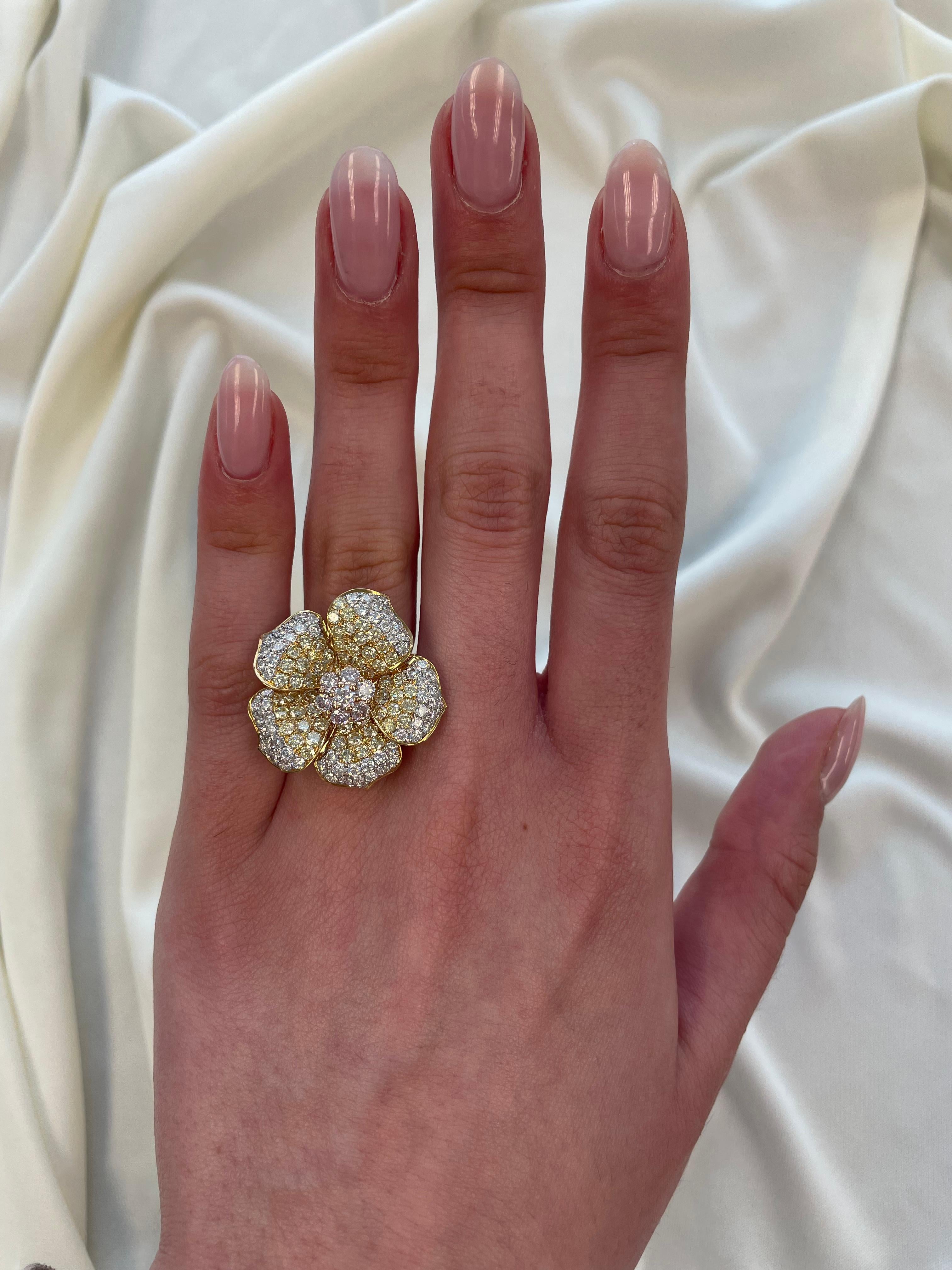 Exquisite and unique pink, yellow, and white diamond floral ring. 
132 round brilliant shape pink, yellow, and white (F/G) color and VS clarity diamonds, 3.48 carats. 18-karat yellow gold, 9.12 grams, current ring size 7.5. 
Accommodated with an