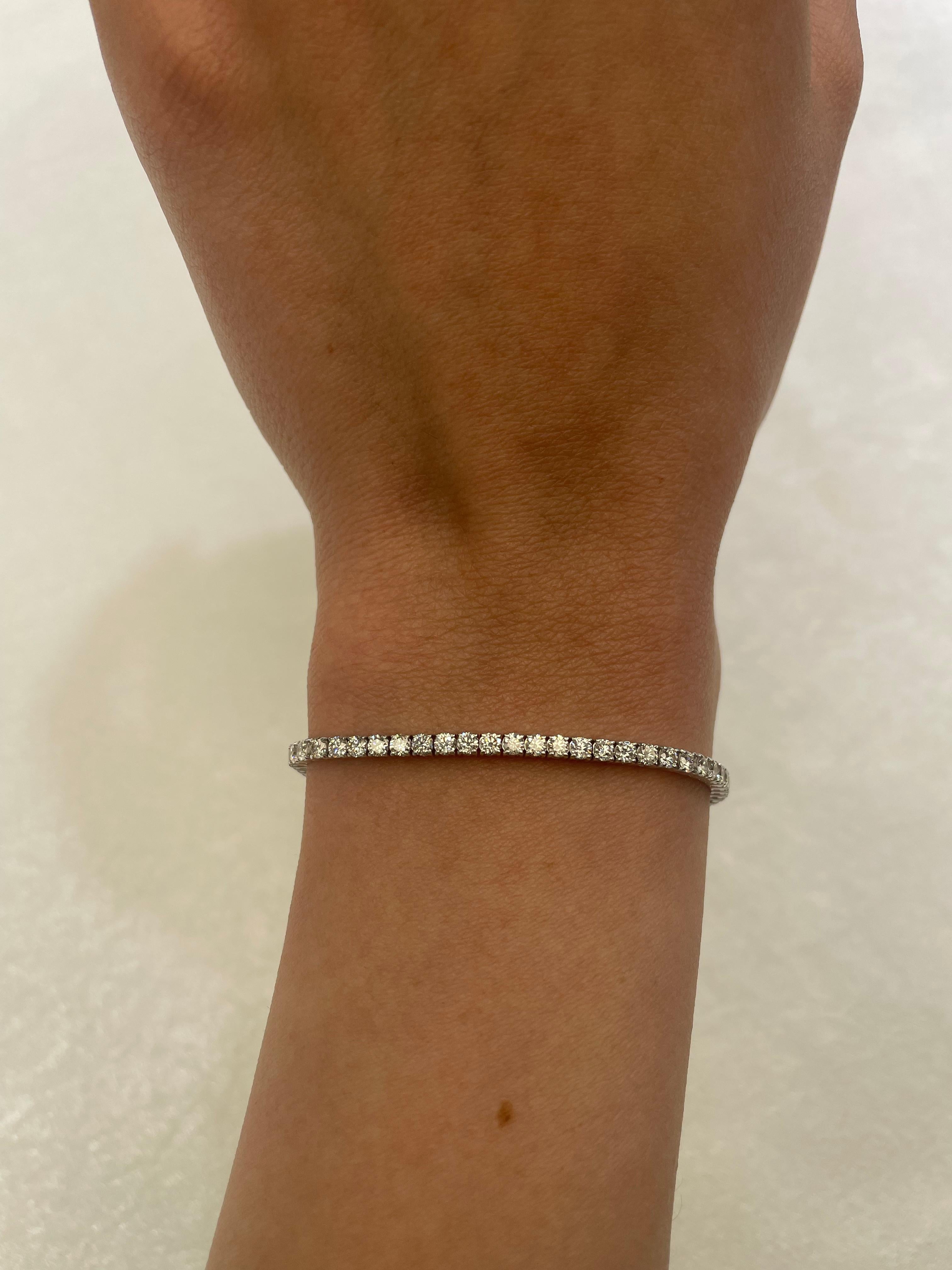Exquisite and timeless diamonds tennis bracelet, by Alexander Beverly Hills.
73 round brilliant diamonds, 3.52 carats total. Approximately G/H color and VS clarity. Four prong set in 14k white gold, 6.63 grams, 7 inches. 
Accommodated with an up to