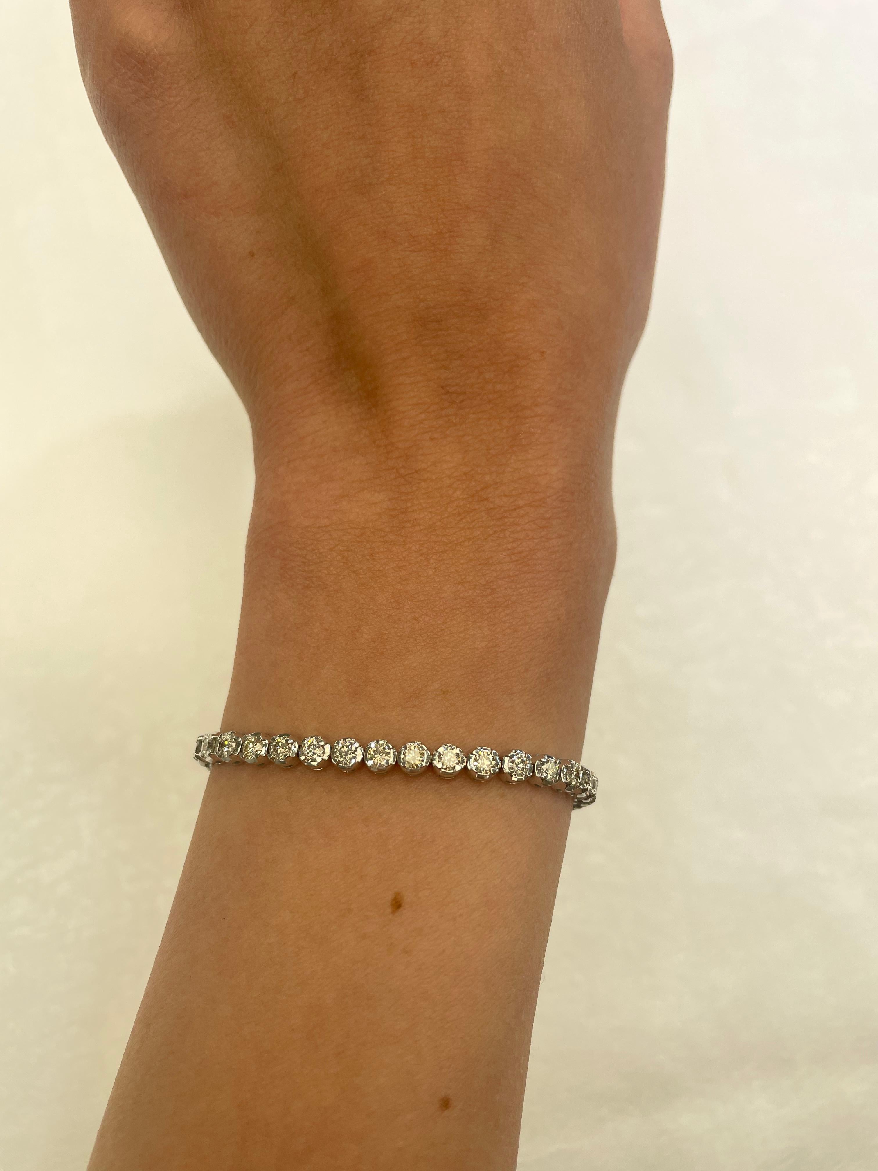 Exquisite and timeless diamonds tennis bracelet, by Alexander Beverly Hills.
40 round brilliant diamonds, 3.80 carats total. Approximately I/J color and SI clarity. Four prong set in 14k white gold, 10.49 grams, 7.75 inches. 
Accommodated with an
