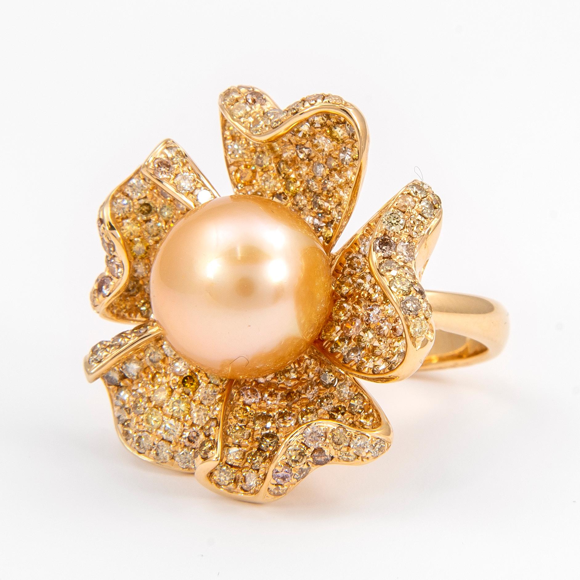 Exquisite and unique multi diamond and pearl floral ring. 
Center South Sea pearl surrounded 257 yellow, brown, and champagne color diamonds, 3.87 carats. 18-karat yellow gold, 12.41 grams, current ring size 7.5. 
Accommodated with an up-to-date