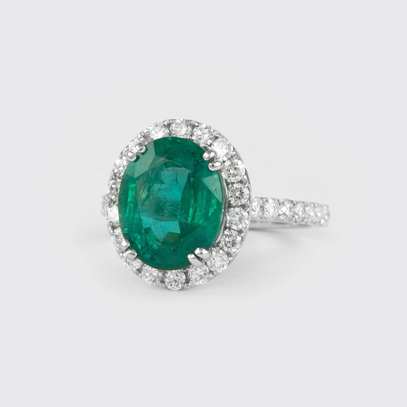 Modern Alexander 4.05 Carat Emerald with Diamond Halo Ring 18 Karat White Gold For Sale