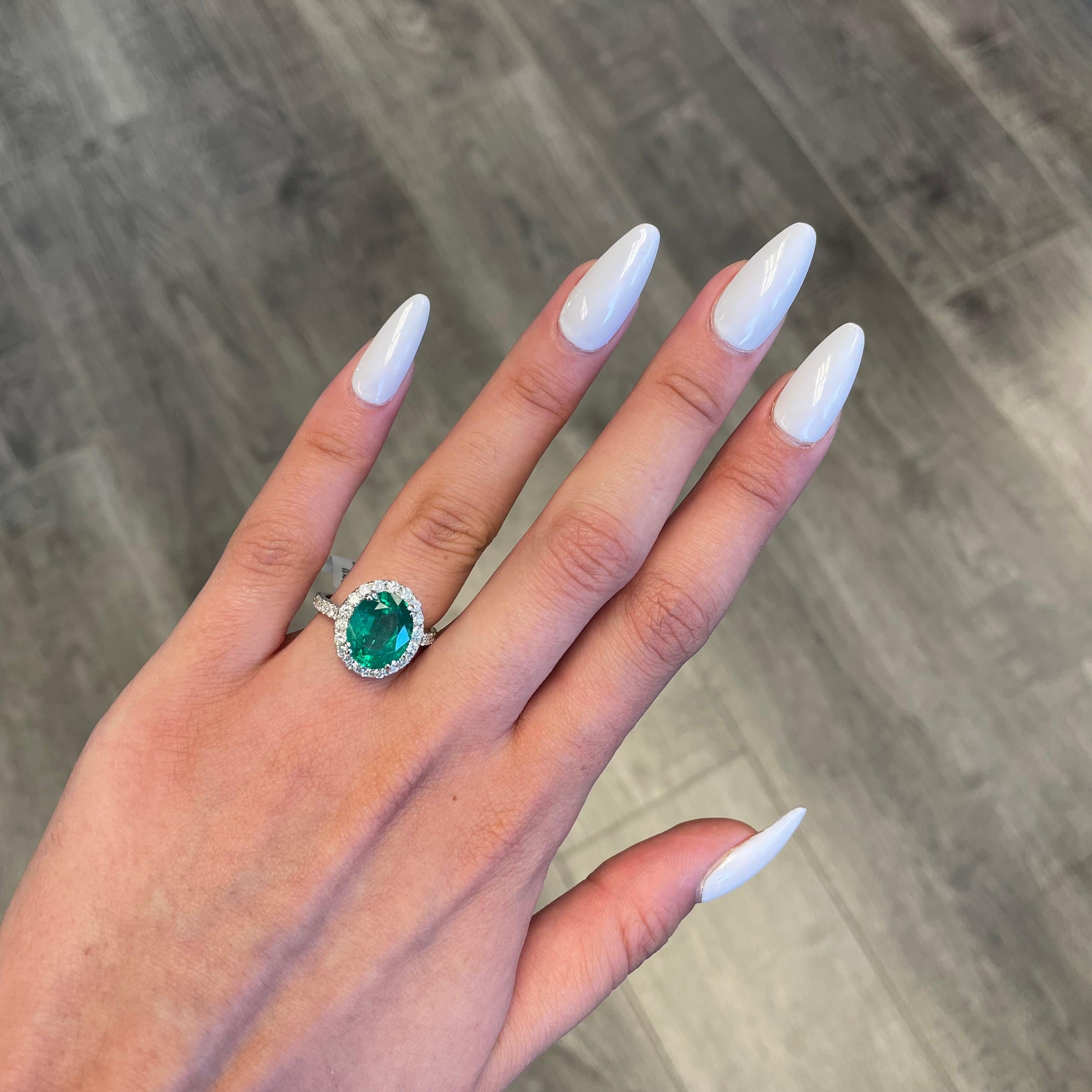 Women's Alexander 4.05 Carat Emerald with Diamond Halo Ring 18 Karat White Gold For Sale