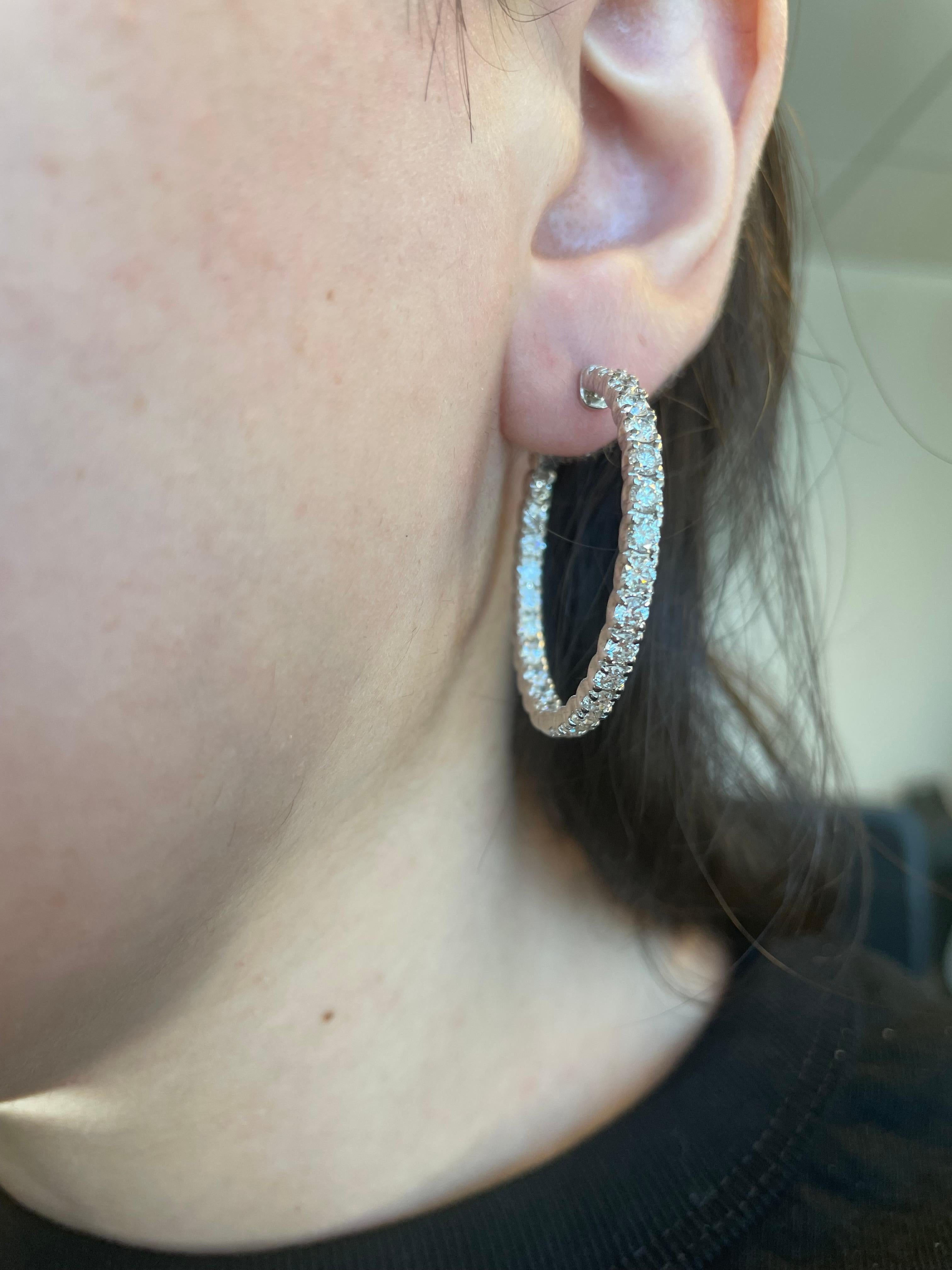 Classic round diamond hoop earrings. By Alexander Beverly Hills.
52 round brilliant diamonds, 4.24 carats total. Approximately G/H color and SI clarity. Four prong set, 14k white gold. 
Accommodated with an up-to-date appraisal by a GIA G.G. once