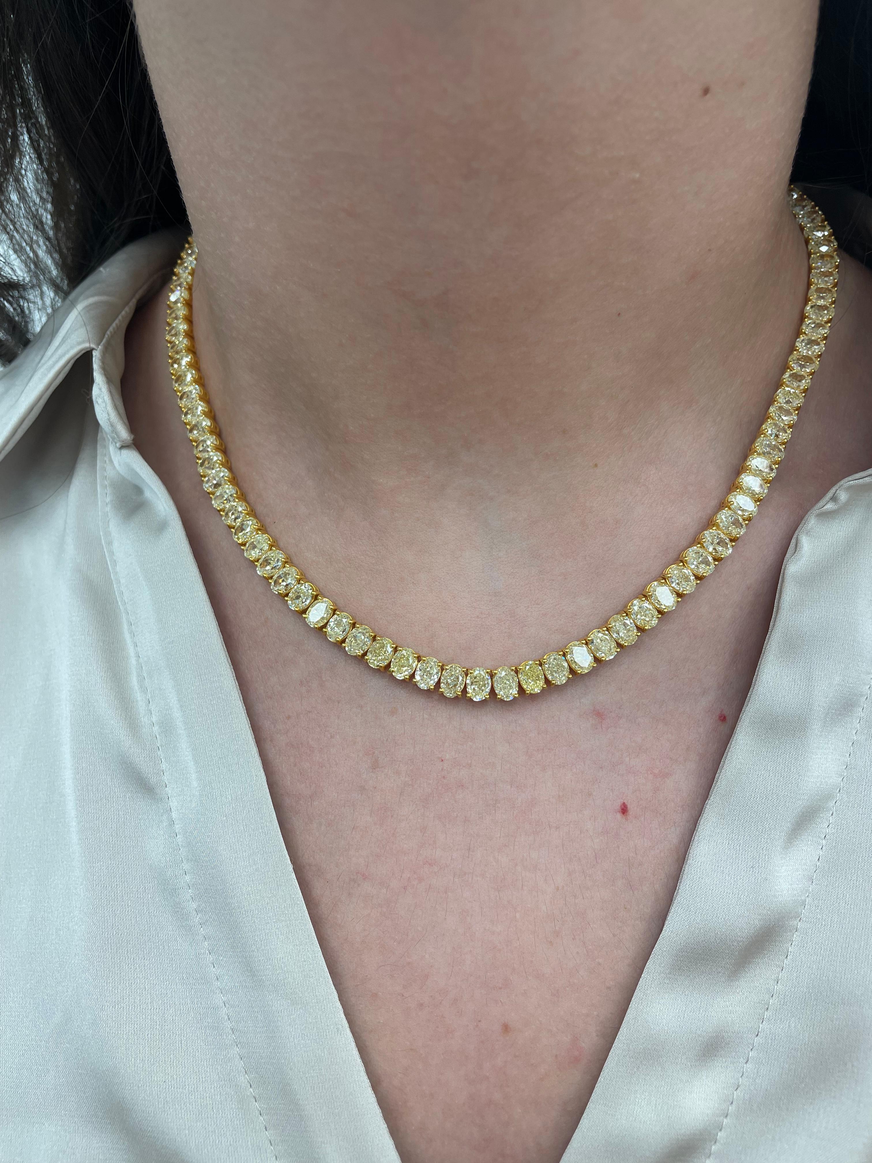 Stunning fancy yellow oval diamond tennis necklace, difficult to find and match the stones. High jewelry by Alexander Beverly Hills.
99 oval diamonds, 43.45 carats total. Approximately Fancy Yellow color and SI clarity. Four prong set in 18k yellow