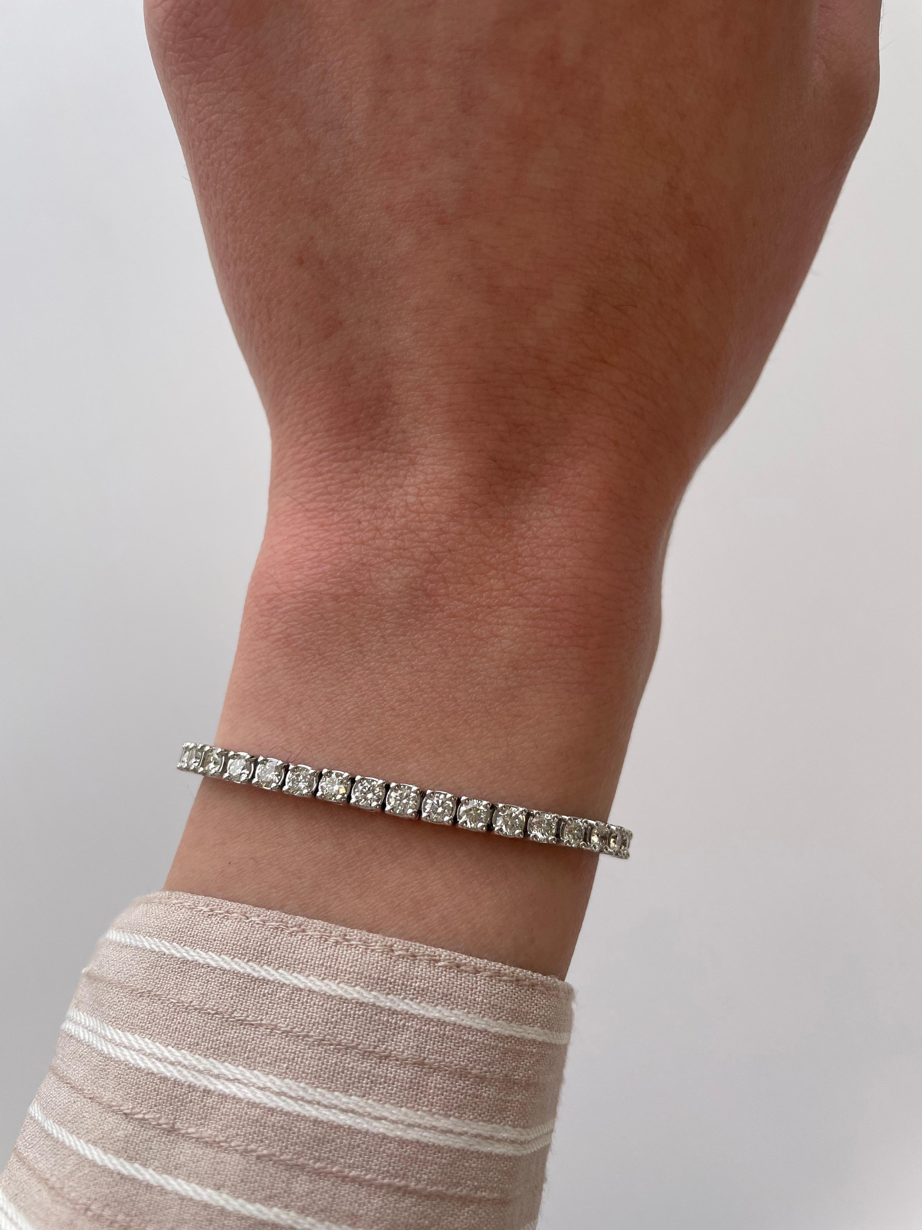 Exquisite and timeless diamonds tennis bracelet, by Alexander Beverly Hills.
49 round brilliant diamonds, 4.39 carats. Approximately H/I color and VVS2/VS1 clarity. Four prong set in 18k white gold, 15.06 grams, 7 inches. 
Accommodated with an