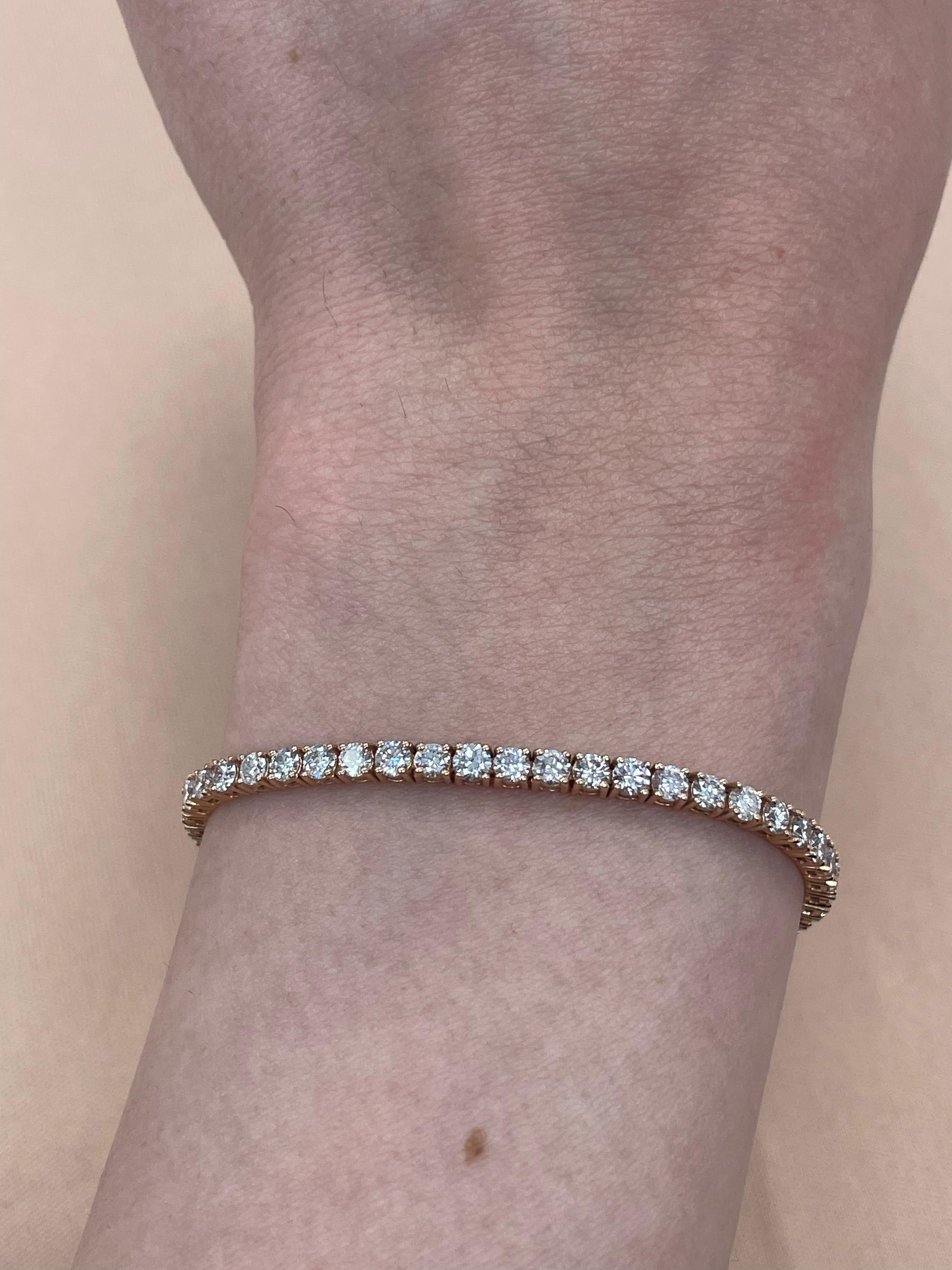 Exquisite and timeless diamonds tennis bracelet, by Alexander Beverly Hills.
63 round brilliant diamonds, 4.42 carats total. Approximately Very Light Pink color (looks like regular white diamonds in mounting) and SI clarity. Four prong set in 14k