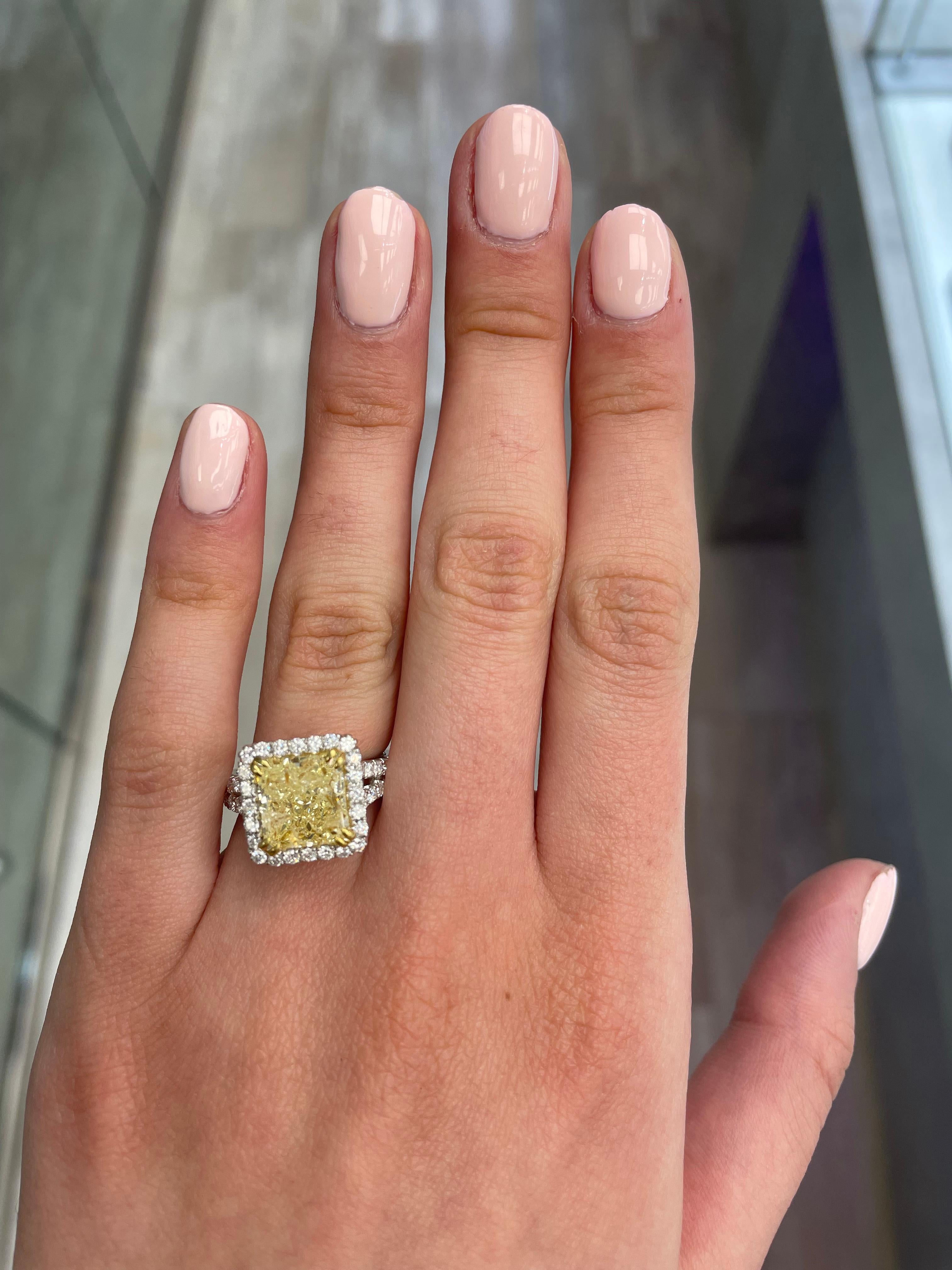 Stunning modern EGL certified yellow diamond with halo ring, two-tone 18k yellow and white gold. By Alexander Beverly Hills
5.43 carats total diamond weight.
4.50 carat radiant cut Fancy Intense Yellow color and I1 clarity diamond, EGL graded.