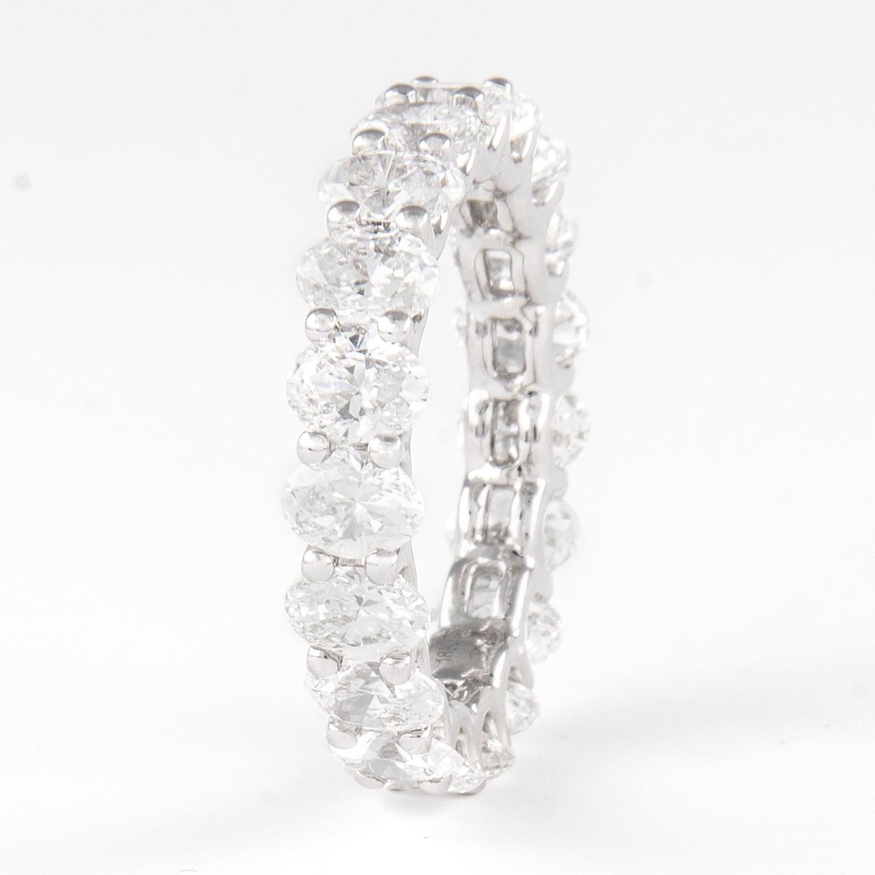 Stunning oval cut diamond eternity band, by Alexander Beverly Hills.
19 cut diamonds, 4.26 carats total. Approximately F color and VS clarity. Set in 18k white gold, 3.35 grams, size 6.5. 
Accommodated with an up-to-date appraisal by a GIA G.G. once