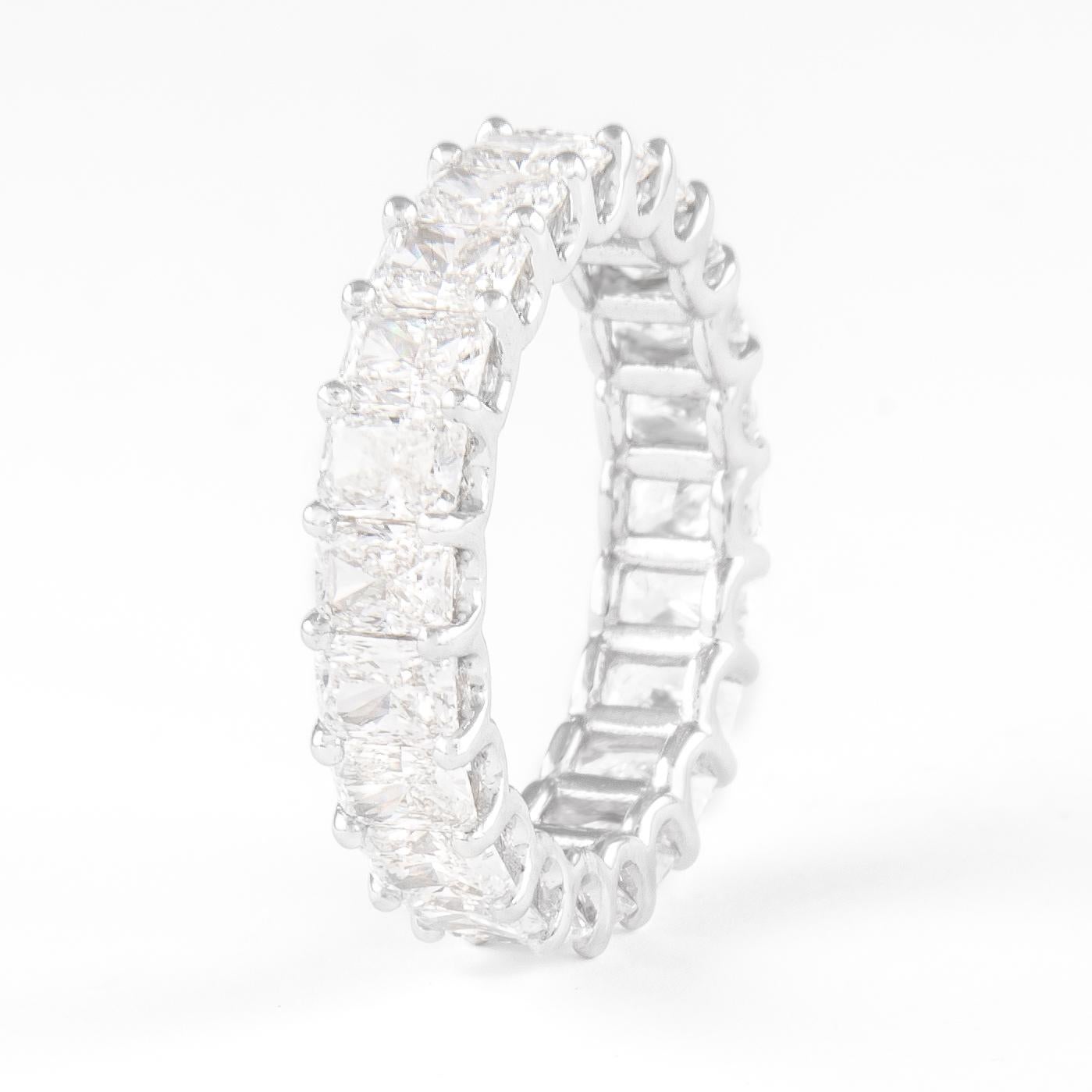 Stunning radiant cut diamond eternity band, by Alexander Beverly Hills.
22 radiant cut diamonds, 4.59 carats total. Approximately D/E color and VS clarity. Set in 18k white gold, 4.25 grams, size 6.5. 
Accommodated with an up-to-date appraisal by a
