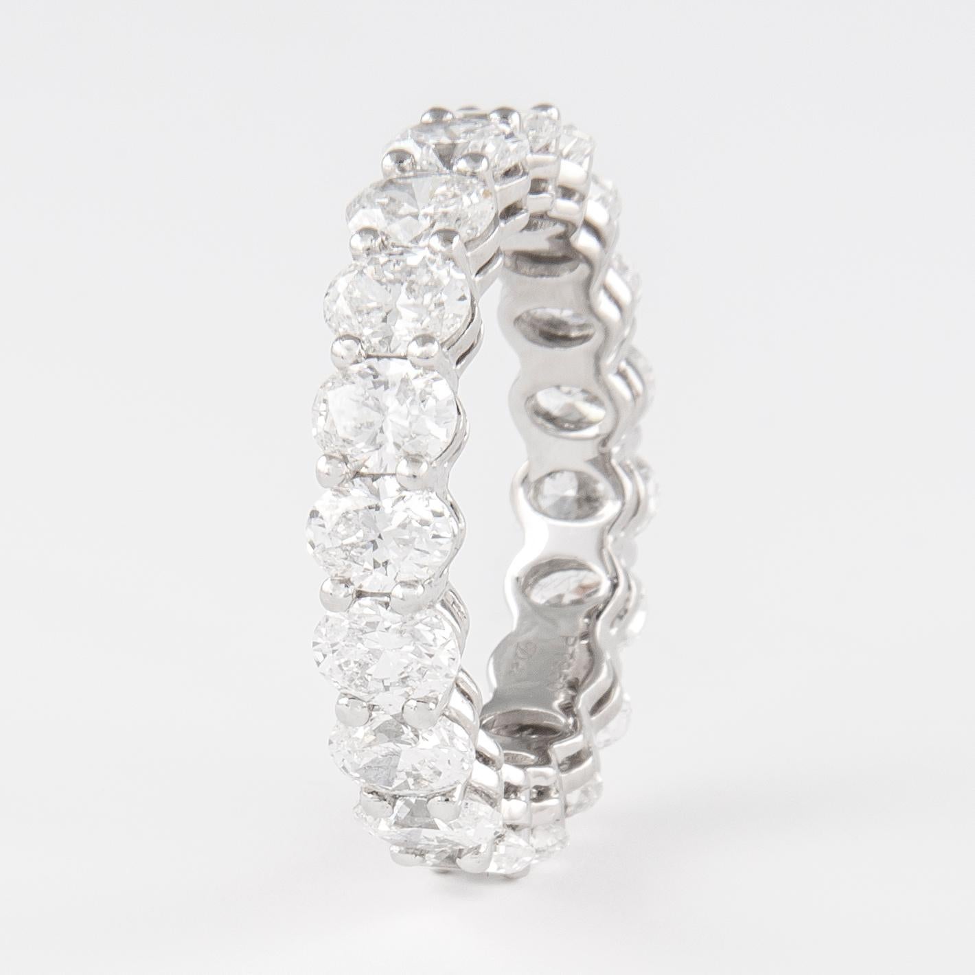 Stunning oval cut diamond eternity band, by Alexander Beverly Hills.
19 oval cut diamonds, 4.63 carats total. Approximately F color and VS clarity. Set in 18k white gold, 5.83 grams, size 6.75. 
Accommodated with an up-to-date appraisal by a GIA