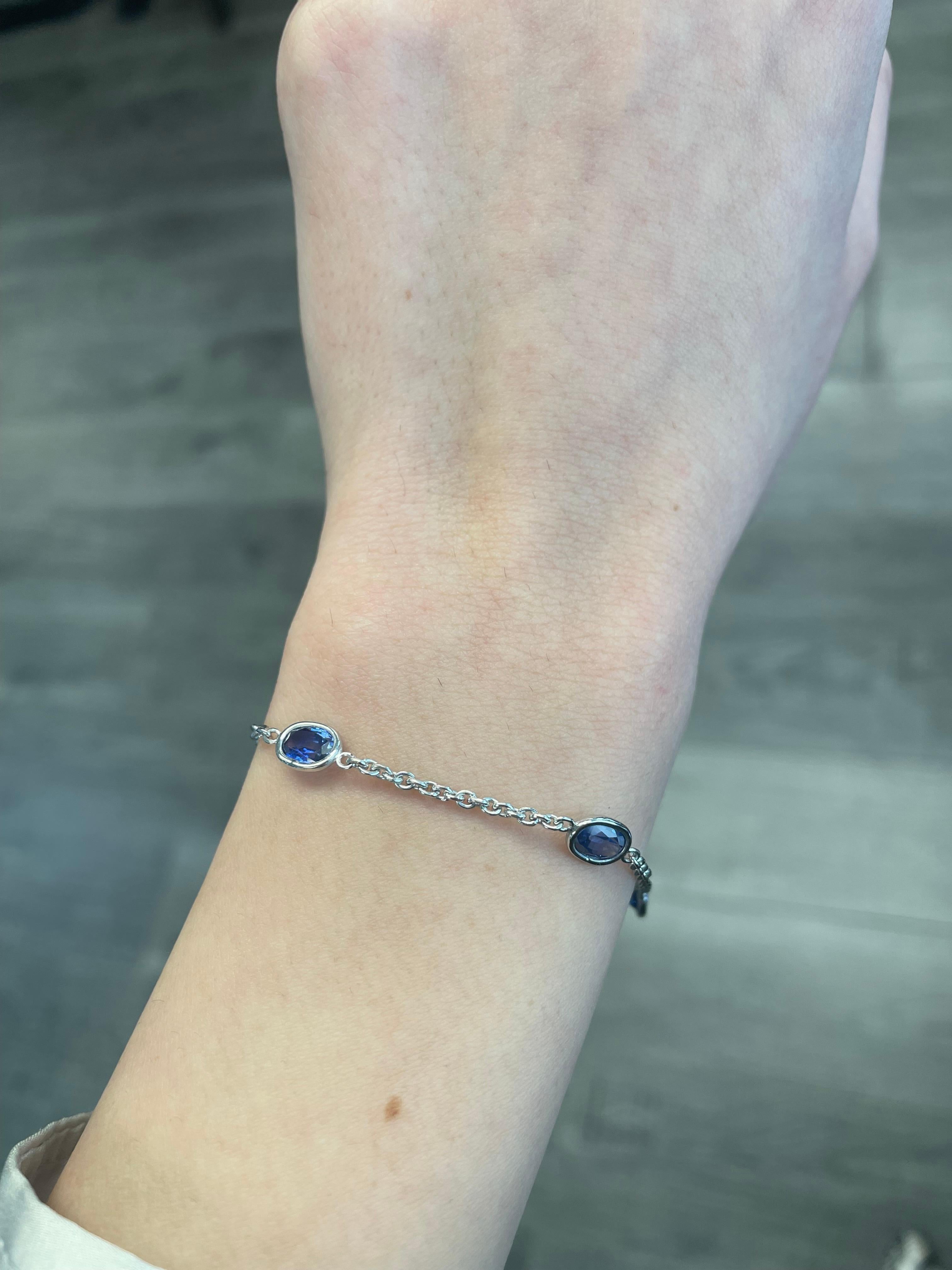 Exquisite sapphires by the yard modern bracelet. By Alexander Beverly Hills.
5 oval sapphires, 4.76 carats, heat. Hand made bezel set in 18k white gold. 
Accommodated with an up to date appraisal by a GIA G.G. upon request. please contact us with
