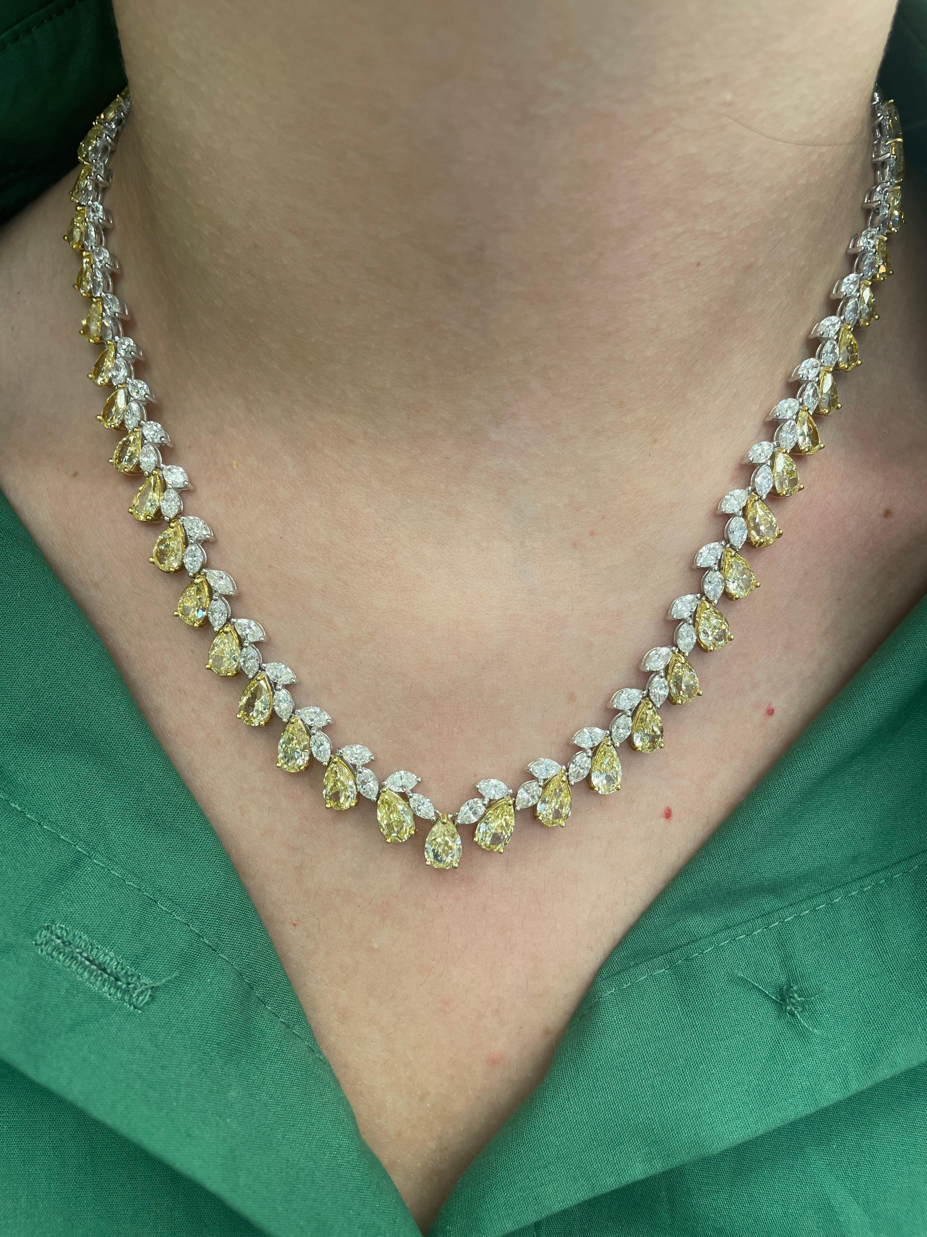 Beautiful yet unique alternating diamond tennis necklace. High jewelry by Alexander Beverly Hills.
50.14 carats total diamond weight.
58 pear shape yellow diamonds, 35.42 carats. Approximately Fancy Yellow color and VS-SI clarity. 118 marques cut