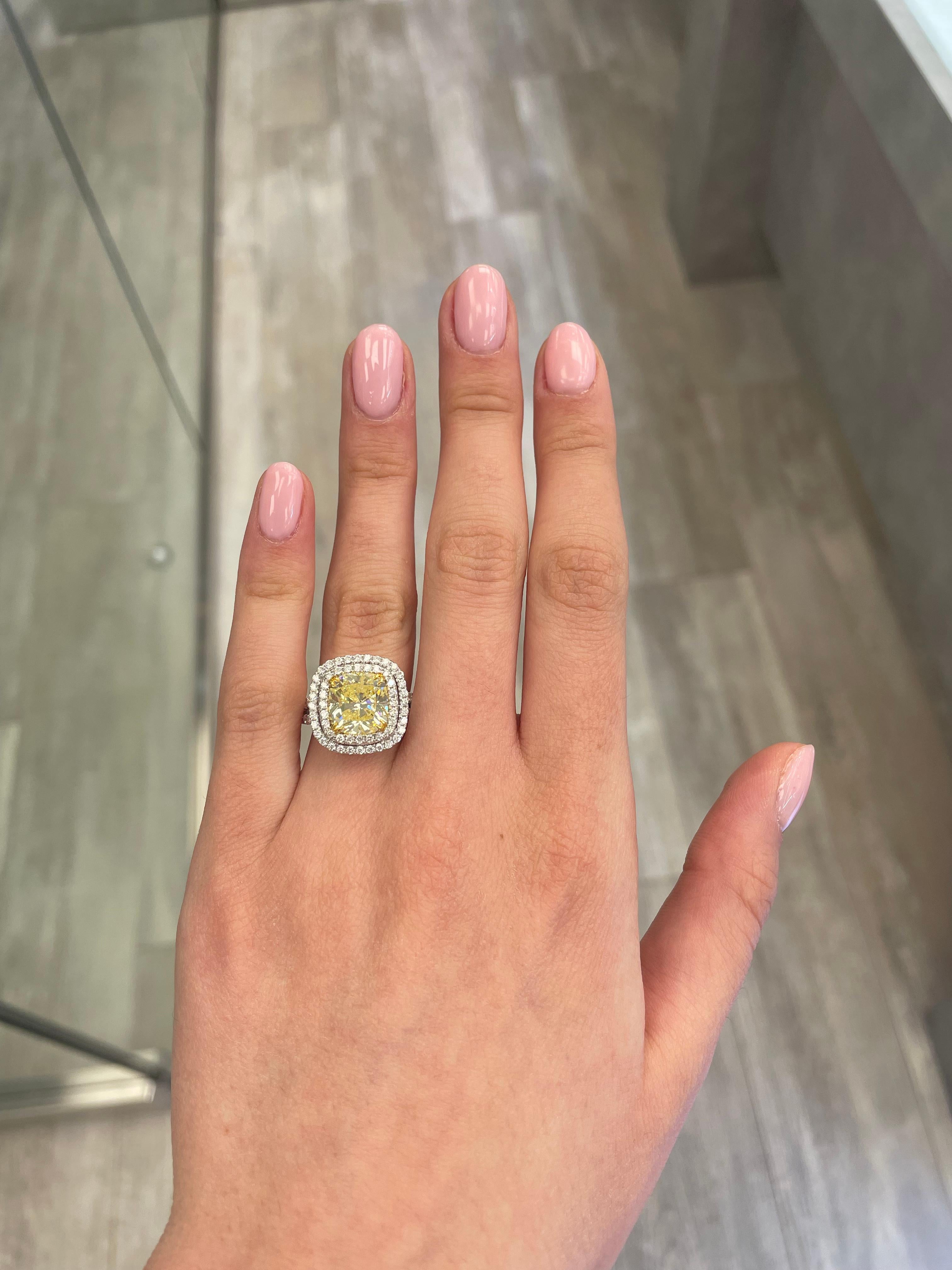 Stunning modern EGL certified fancy yellow fancy yellow diamond with double diamond halo ring, two-tone 18k white and yellow. 
High jewelry by Alexander Beverly Hills.
5.07 carats total diamond weight.
4.05 carat cushion Fancy Yellow Fancy Yellow