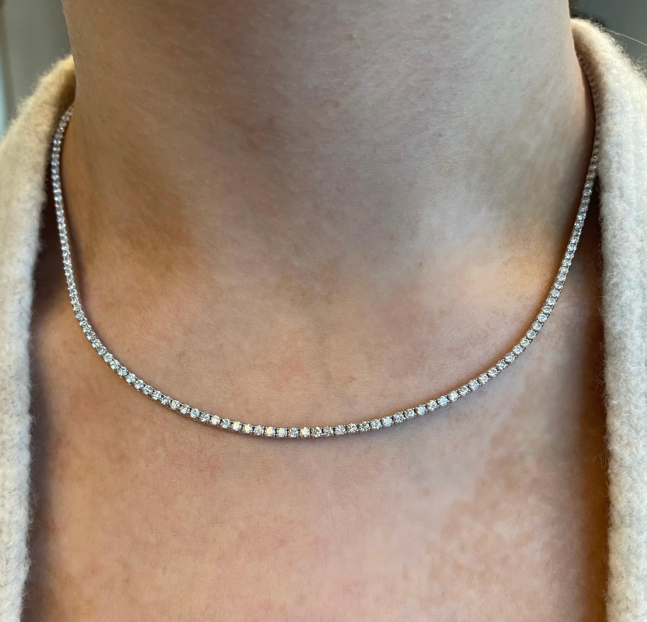 Beautiful and classic diamond tennis necklace. By Alexander Beverly Hills.
5.09 carats of round brilliant diamonds, approximately G/H color and SI clarity. 18k white gold, 18.90 grams, 17in.
Accommodated with an up to date appraisal by a GIA G.G.,