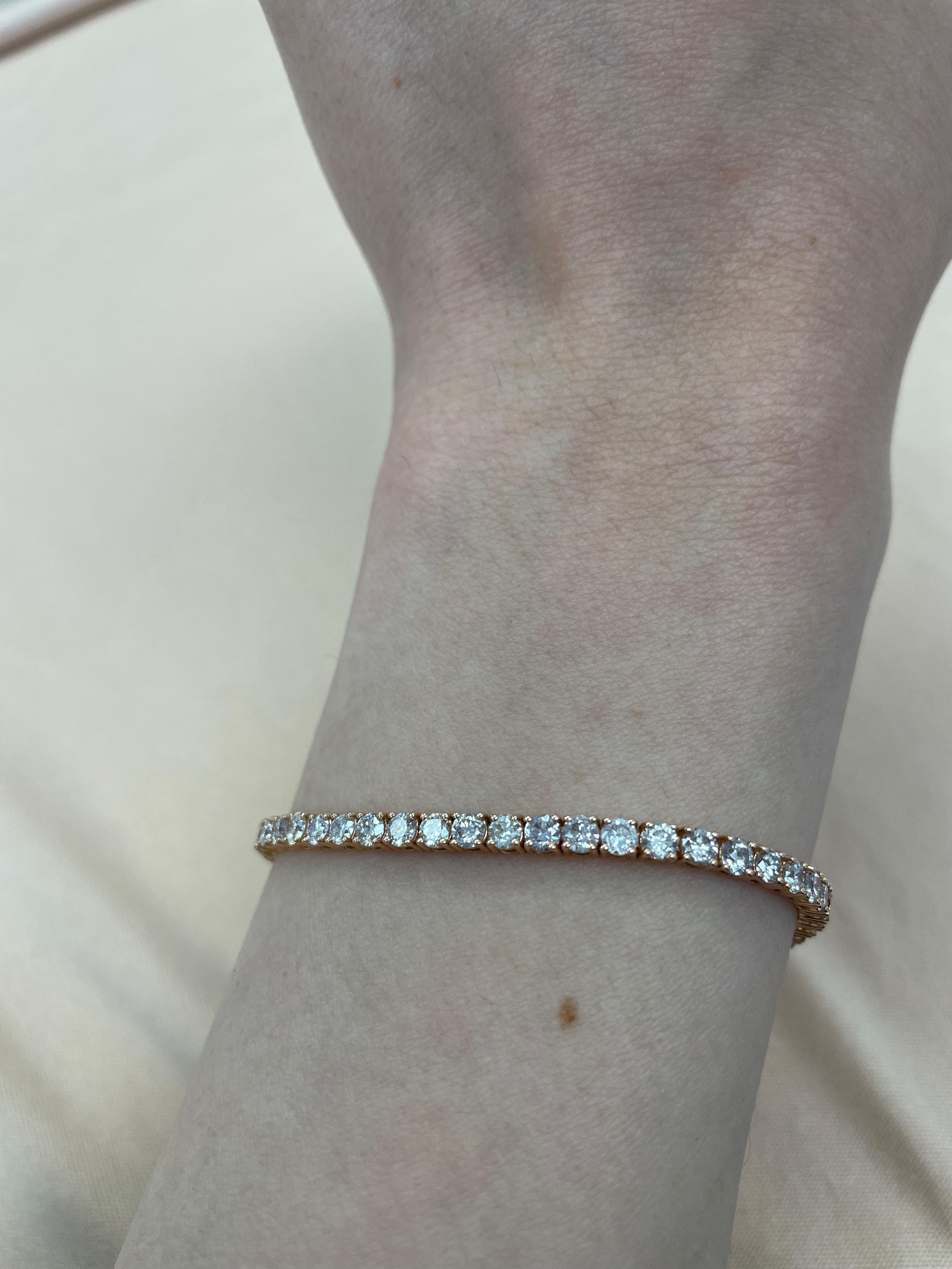 Exquisite and timeless diamonds tennis bracelet, by Alexander Beverly Hills.
59 round brilliant diamonds, 5.18 carats total. Approximately Very Light Pink color (looks like regular white in mounting) and SI clarity. Four prong set in 14k rose gold,