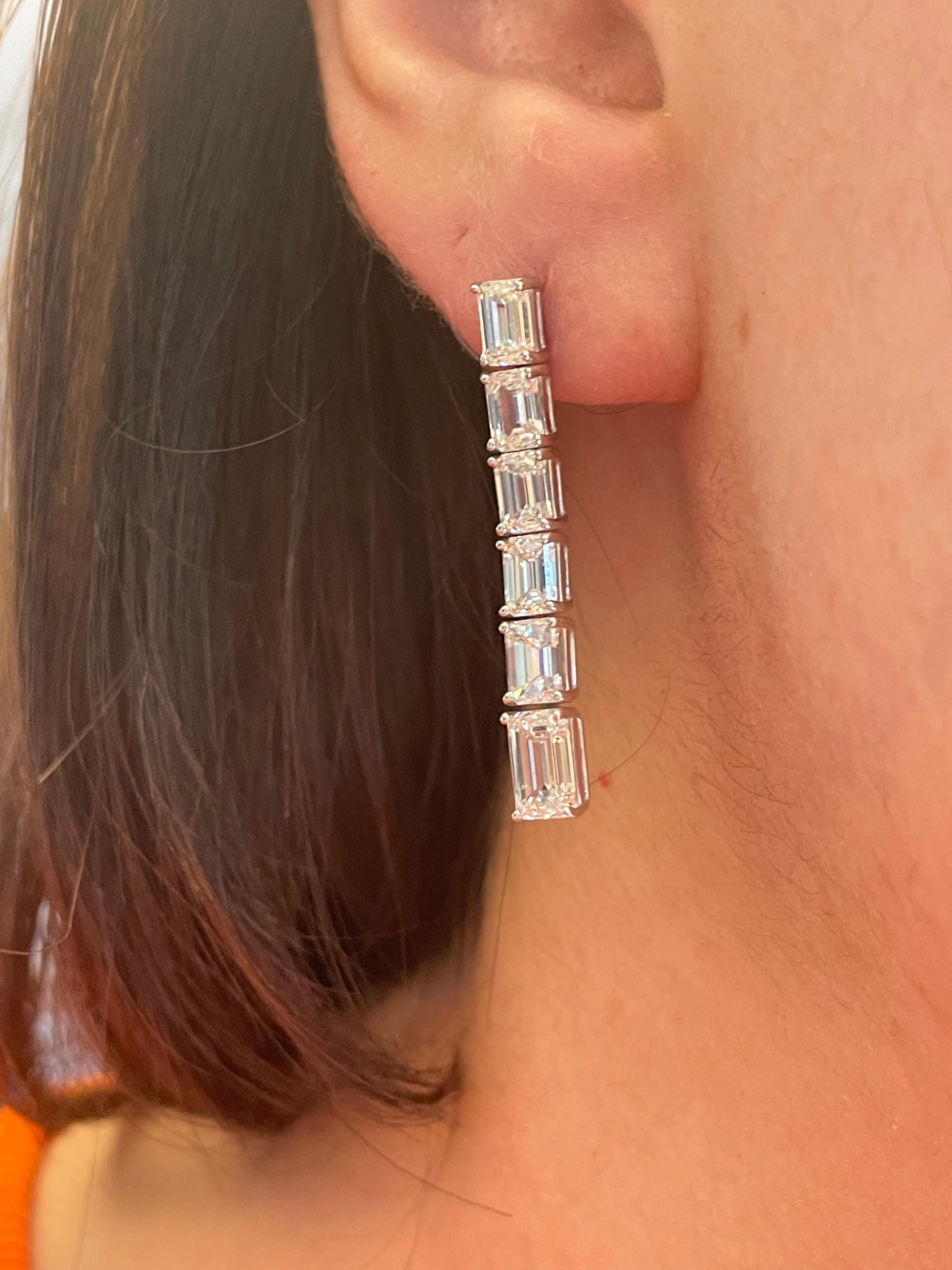 Stunning dangling diamond earring, GIA certified. By Alexander Beverly Hills.
5.33 carats total diamond weight.
Bottom/center 2 emerald cut diamonds, 1.44 carats. Approximately H/I color and VS clarity. 10 emerald cut diamonds, 3.89 carats.