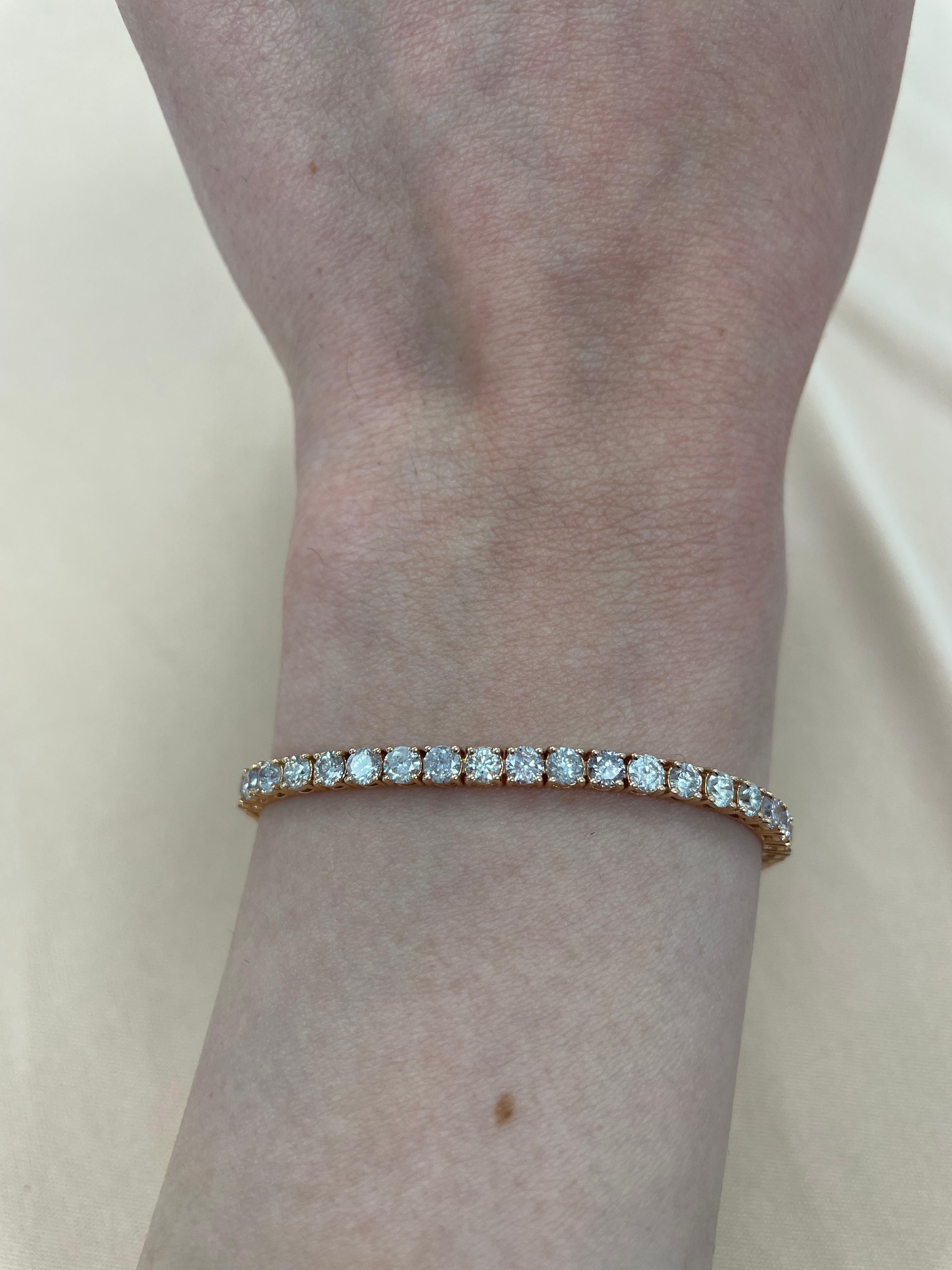 Exquisite and timeless diamonds tennis bracelet, by Alexander Beverly Hills.
53 round brilliant diamonds, 5.55 carats total. Approximately Very Light Pink color (looks like regular white diamonds in mounting) and SI clarity. Four prong set in 14k