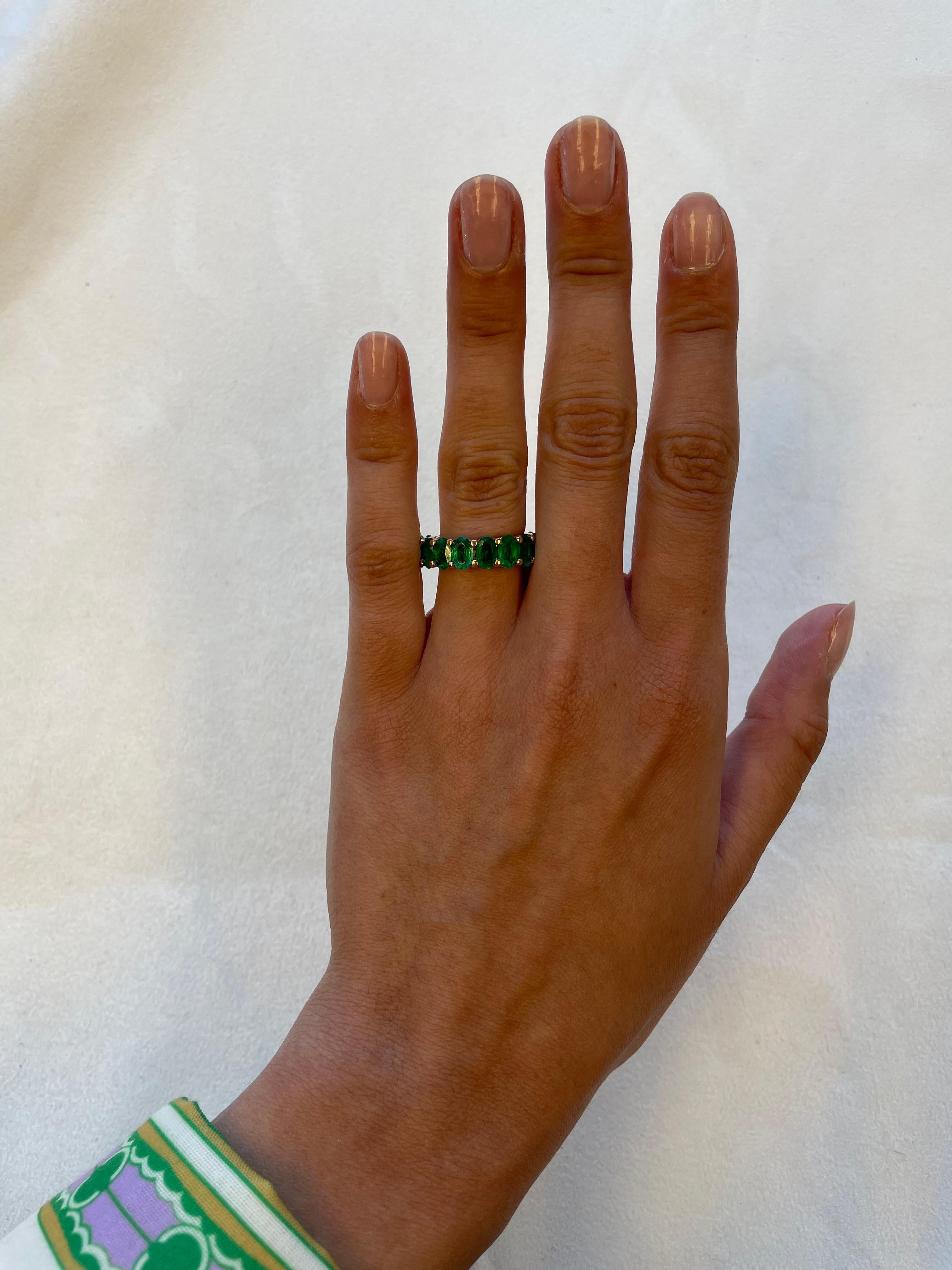Stunning and modern emerald eternity band, By Alexander Beverly Hills.
17 oval cut emeralds, 5.65 carats, apx F2. 18-karat yellow gold, 5.42 grams, size 6.5.
Accommodated with an up-to-date appraisal by a GIA G.G. once purchased, upon request.