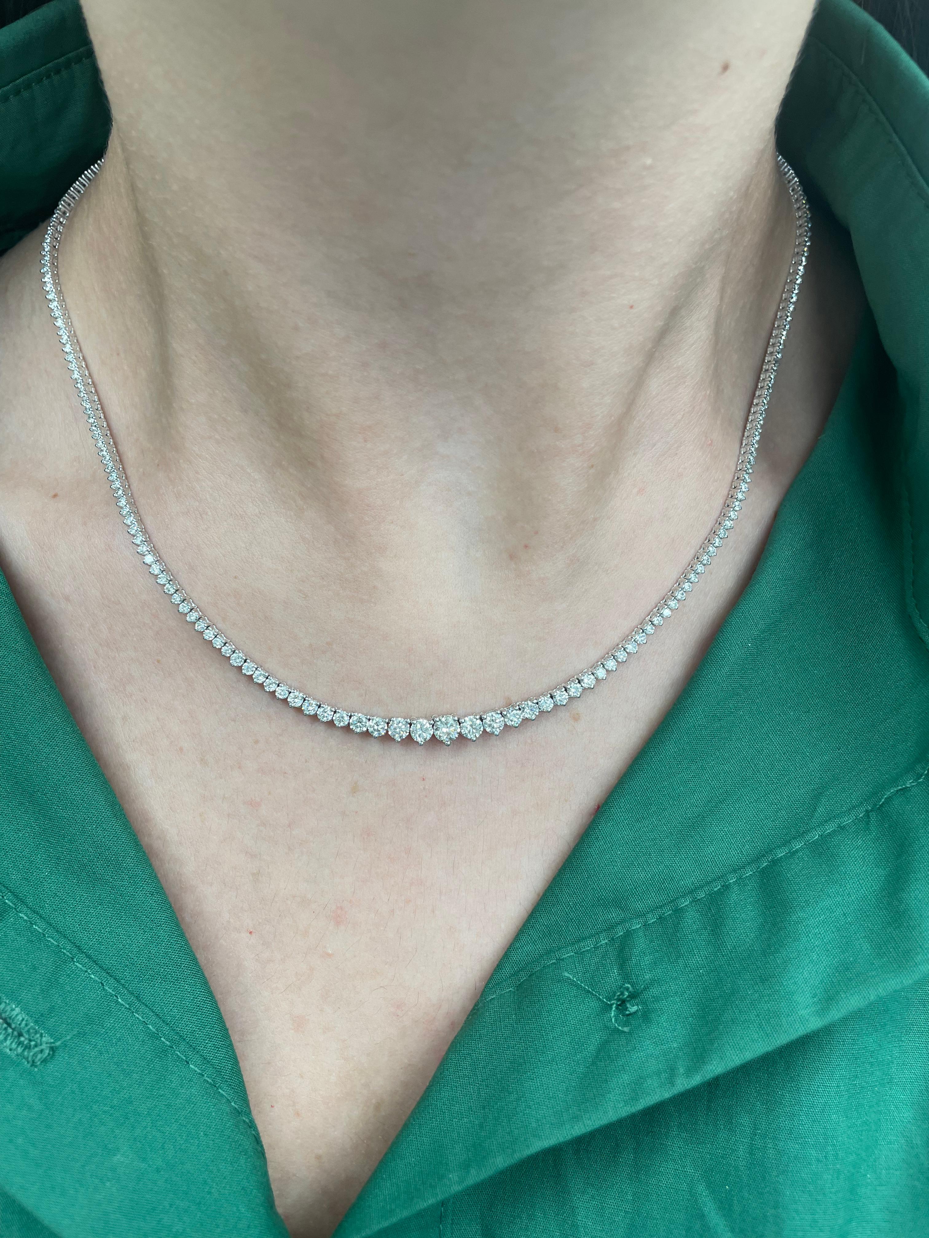 Beautiful and classic diamond tennis riviera necklace, by Alexander Beverly Hills.
5.84 carats of round brilliant diamonds, approximately F-I color and VVS2-VS2 clarity. 14k white gold, 15.89 grams, three prong set, 17.5n.
Accommodated with an