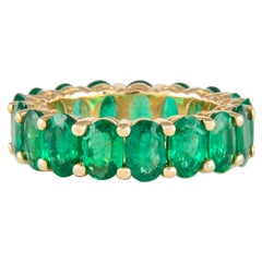 Alexander 6.14 Carat Oval Emerald Eternity Band 18k Yellow Gold