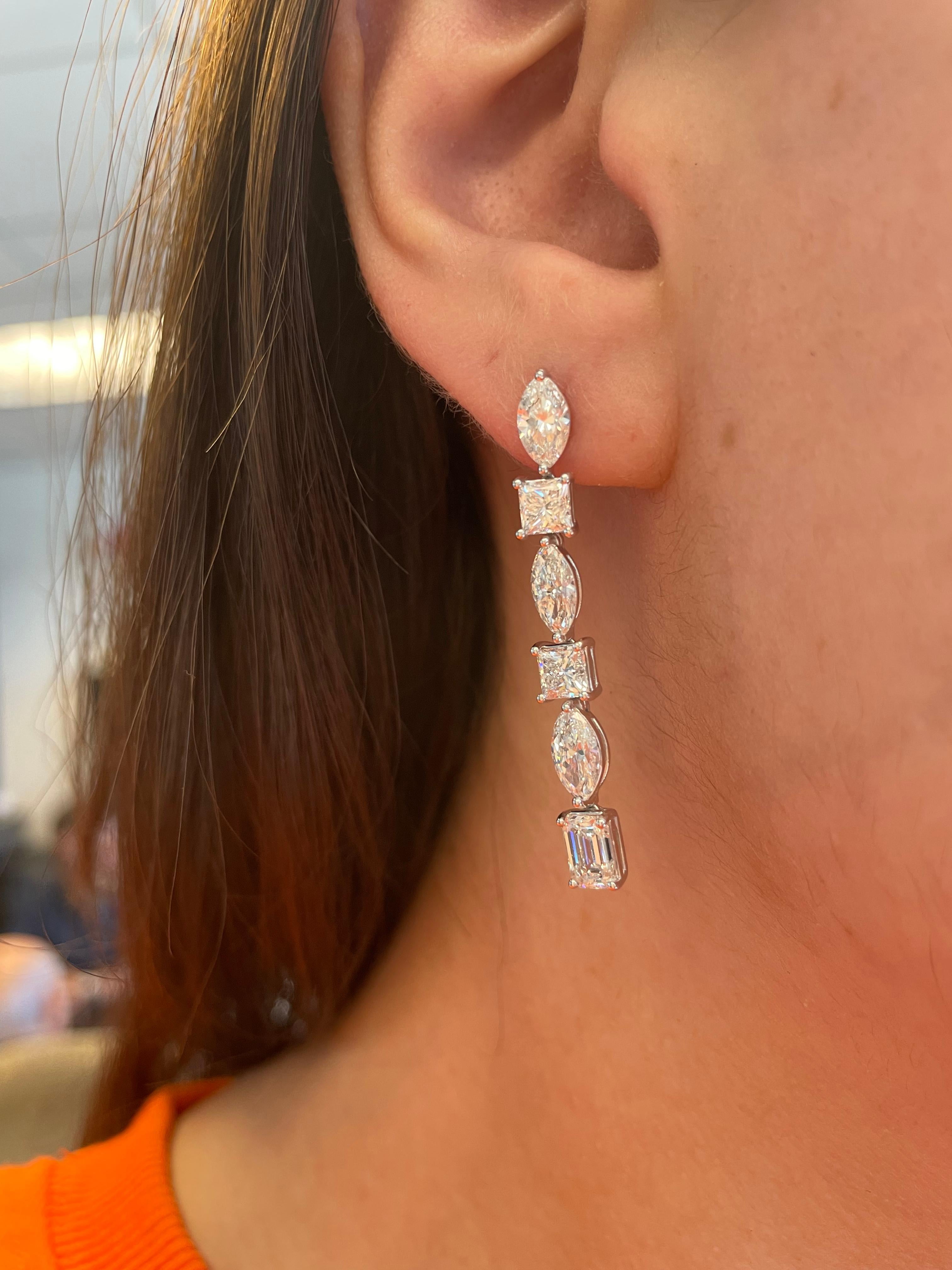 Stunning multi diamond dangling diamond earrings. By Alexander Beverly Hills.
6.52 carats total diamond weight.
2 emerald cut diamonds, 1.49 carats. Approximately G/H color and VS clarity. 4 princess cut diamonds, 1.98 carats. Approximately G/H