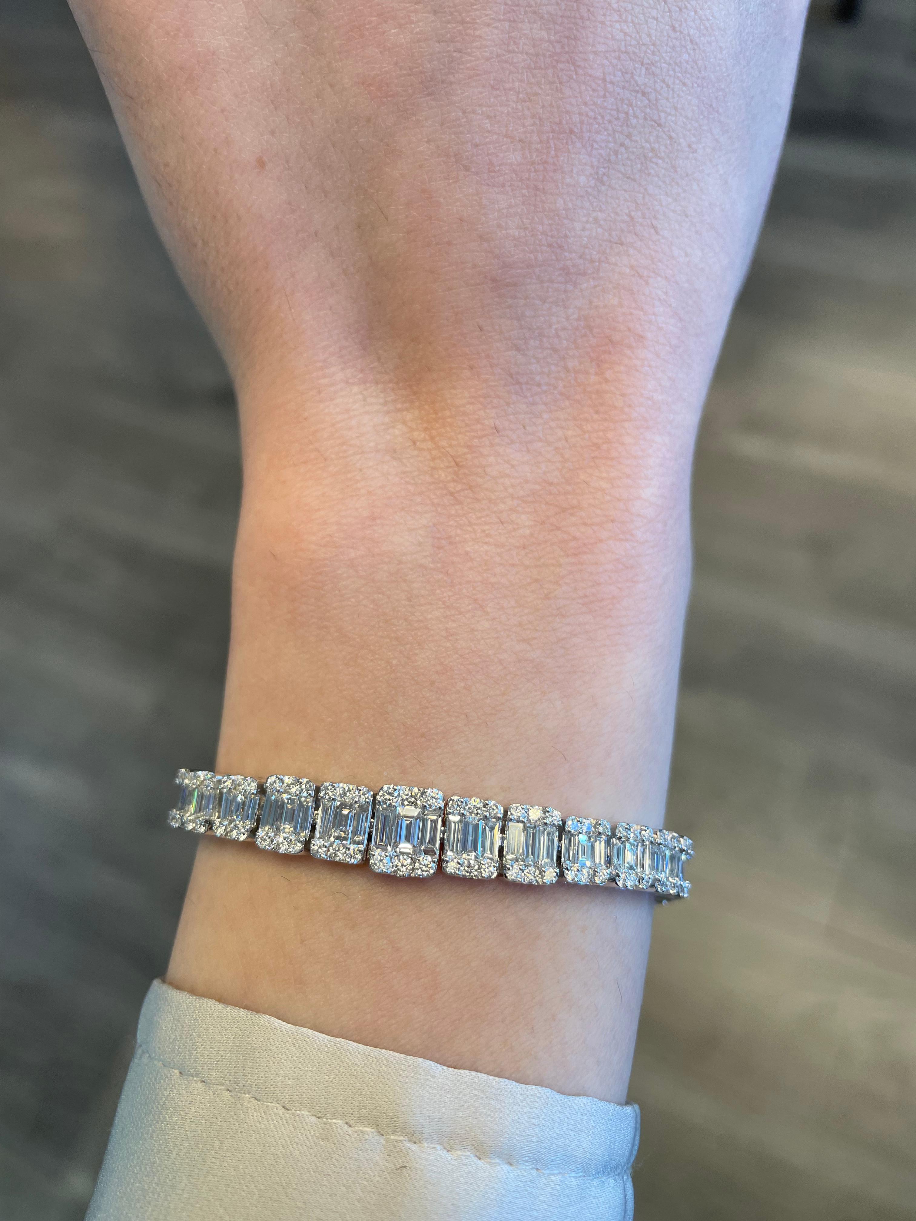 Sensational modern round and baguette 18k white gold bracelet.. By Alexander Beverly Hills.
369 round and baguette cut diamonds, 6.56 carats. Approximately G/H color and VS1-SI1 clarity. 18-karat white gold, 23.12 grams, 7 inches.
Accommodated with