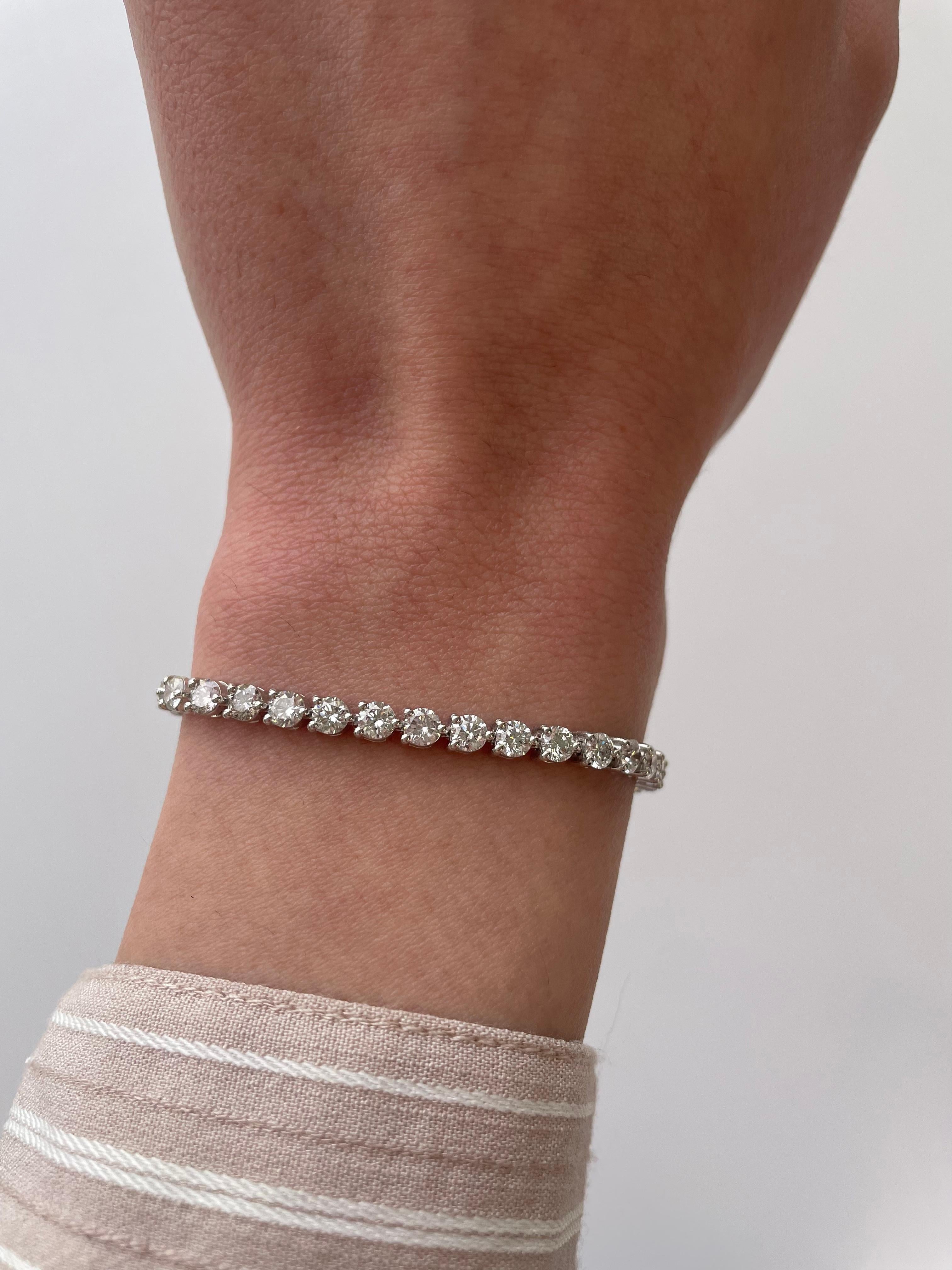 Beautiful and classic diamond tennis bracelet, by Alexander Beverly Hills.
41 round brilliant diamonds, 6.91 carats. Approximately H/I color and VS clarity. 18k white gold, three prong set, 7in.
Accommodated with an up-to-date appraisal by a GIA