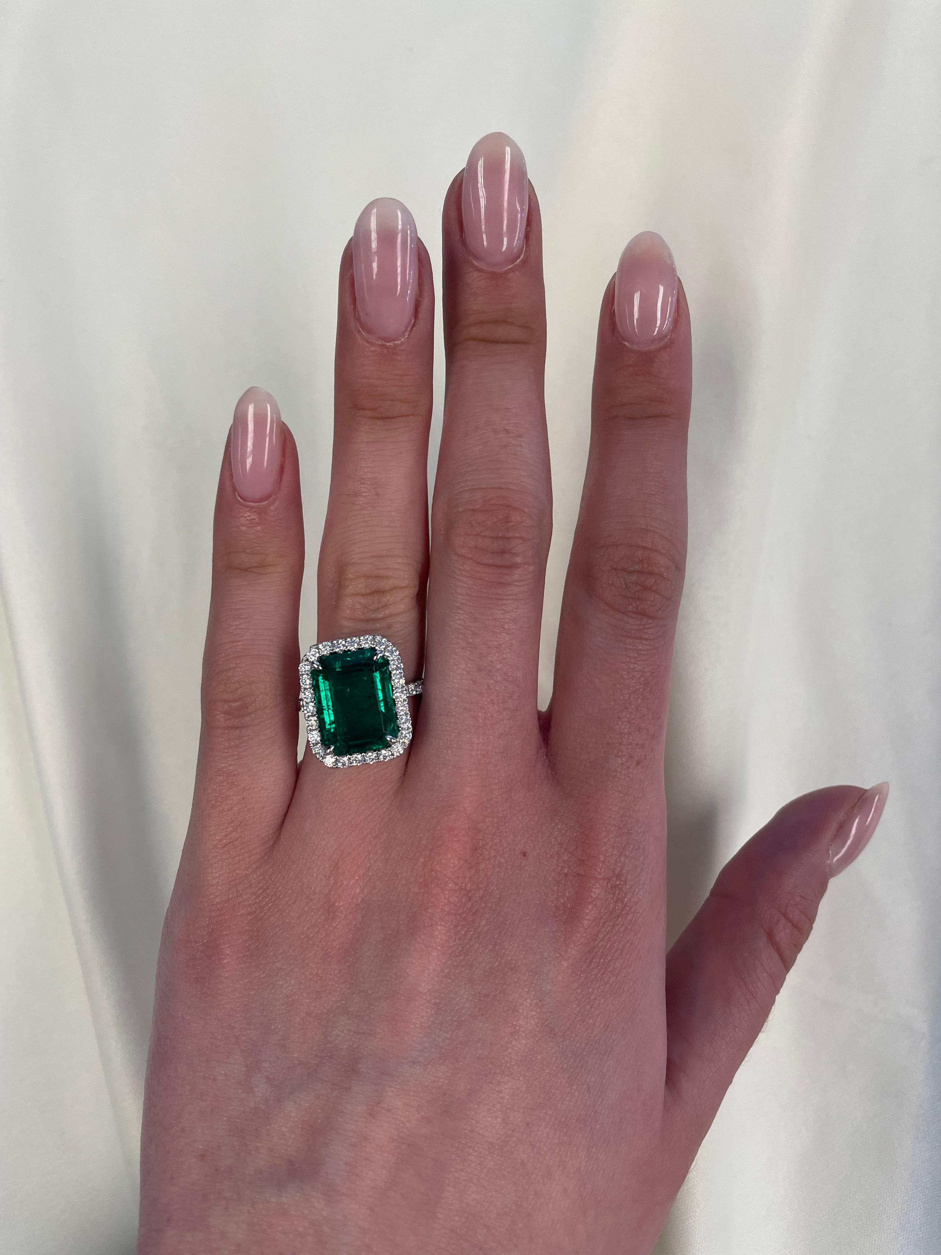 Stunning emerald of superb color with diamond halo ring, GIA certified. High jewelry by Alexander Beverly Hills. 
8.12 carats total gemstone weight.
GIA certified 7.29 carat emerald cut emerald (faces up like a 10ct), F2. 38 round brilliant