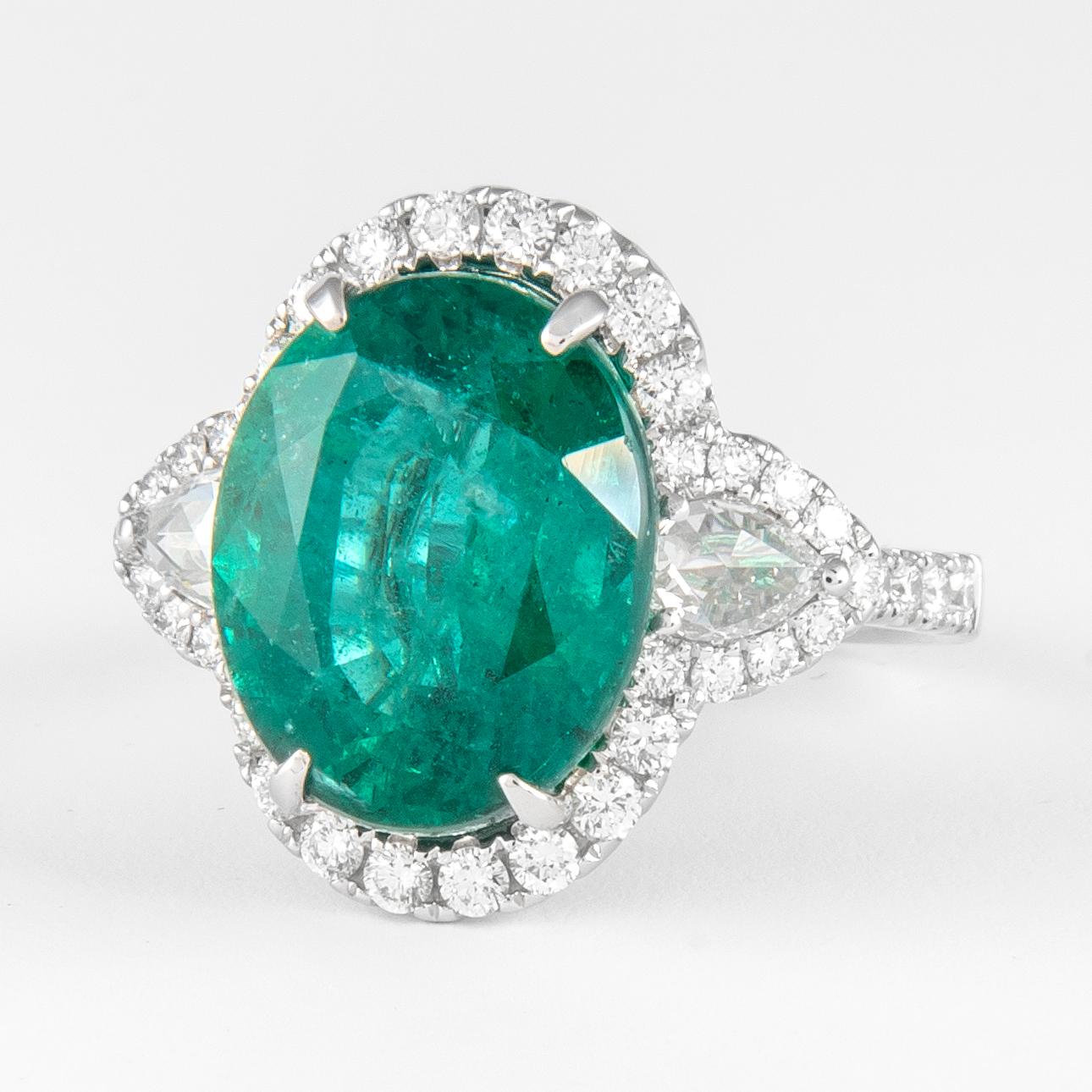 Contemporary Alexander 8.50ct Oval Emerald with Diamond Three Stone Halo Ring 18 Karat Gold For Sale