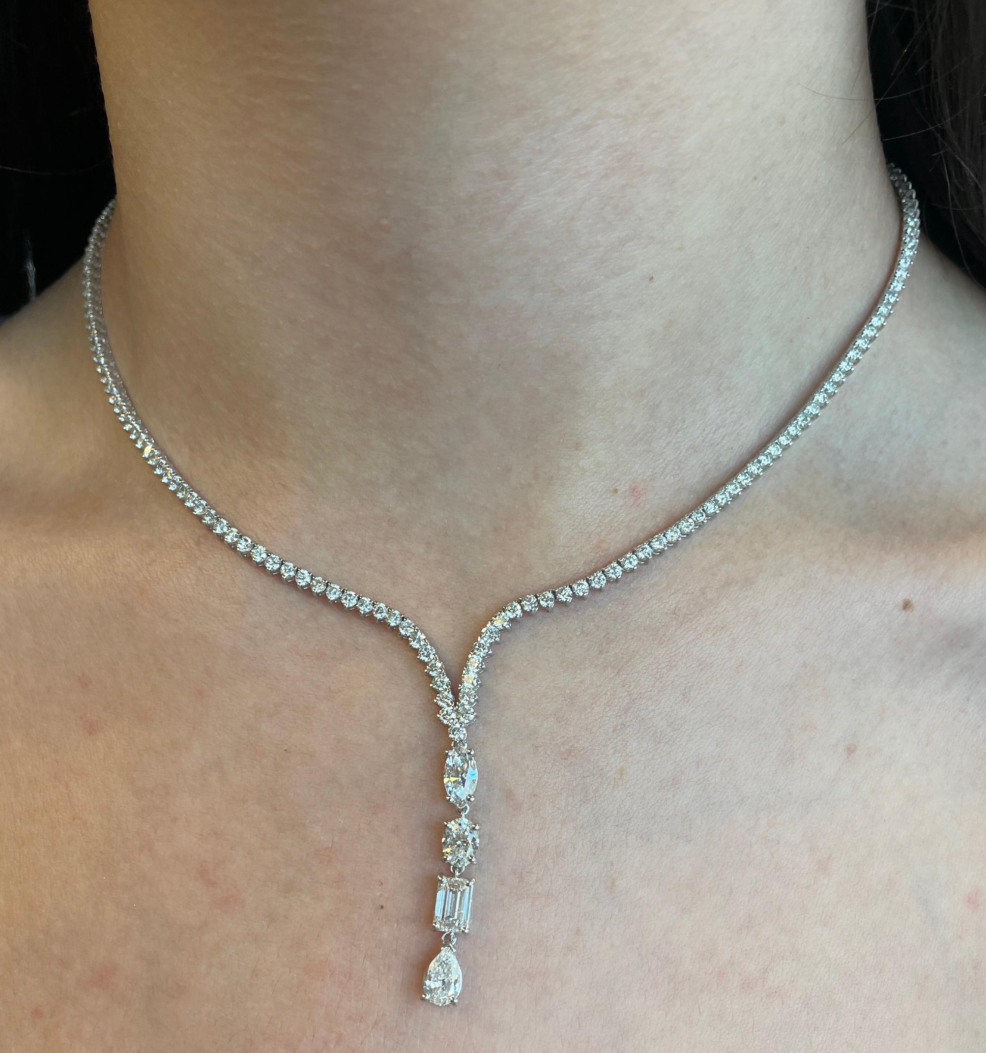 Exquisite and timeless diamonds drop tennis necklace. High jewelry by Alexander Beverly Hills.
Center marquise, oval, emerald cut and pear diamond, 2.22 carats. Approximately G/H color and VS clarity. 179 round brilliant diamonds, 6.42 carats total.