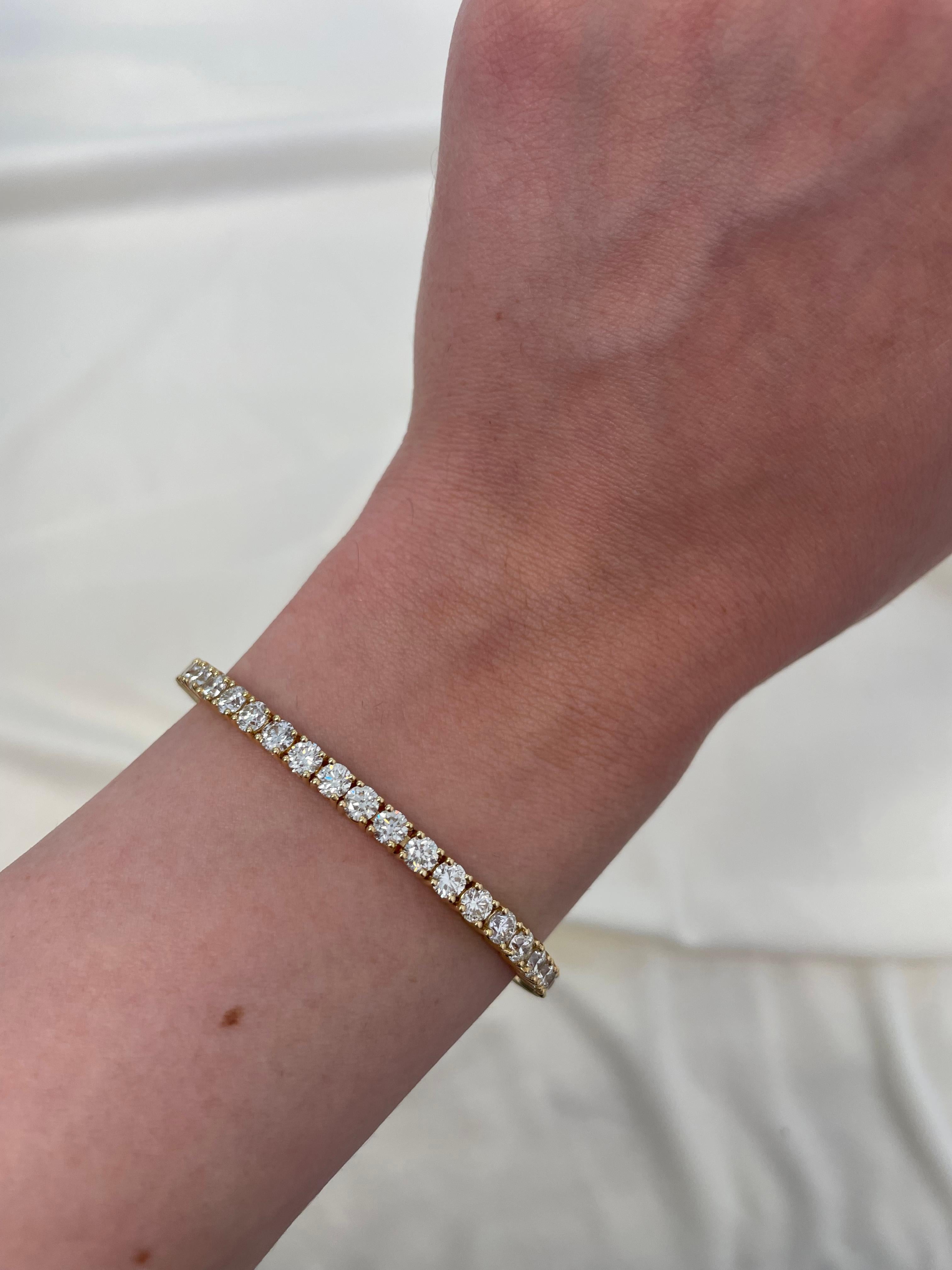 Exquisite and timeless diamonds tennis bracelet, by Alexander Beverly Hills.
49 round brilliant diamonds, 8.78 carats total. Approximately H-J color and VS clarity. Four prong set in 18k yellow gold, 16.38 grams, 7 inches. 
Accommodated with an
