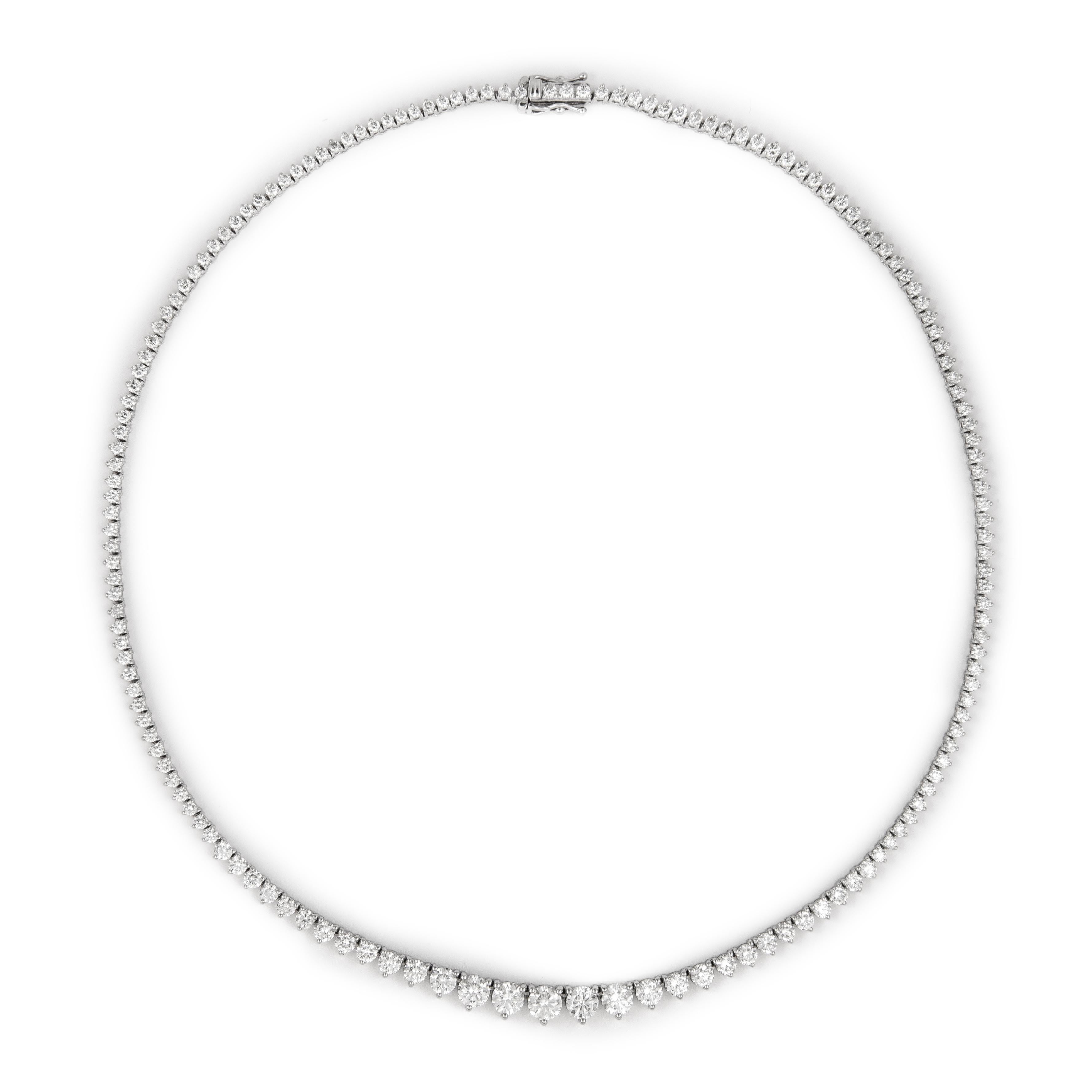 Beautiful and classic diamond tennis riviera necklace, by Alexander Beverly Hills.
9.26 carats of round brilliant diamonds, approximately I/J color and SI clarity. Three prong, 18k white gold, 18.90 grams, 16.5In.
Accommodated with an up-to-date