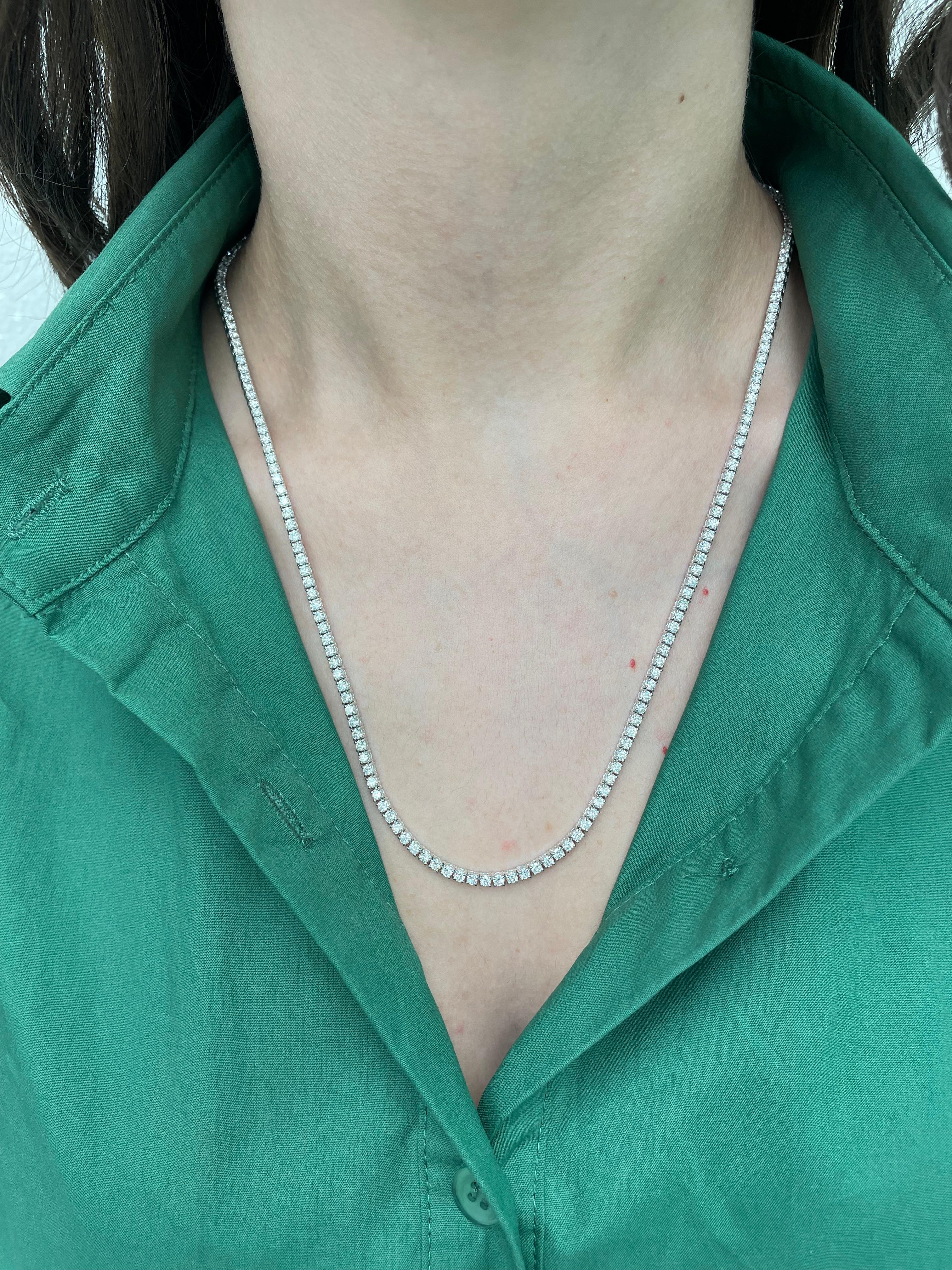 Beautiful and classic long diamond tennis necklace, by Alexander Beverly Hills.
9.57 carats of round brilliant diamonds, approximately D-F color and SI clarity. 14k white gold, 25.36 grams, prong set, 22in.
Accommodated with an up-to-date appraisal