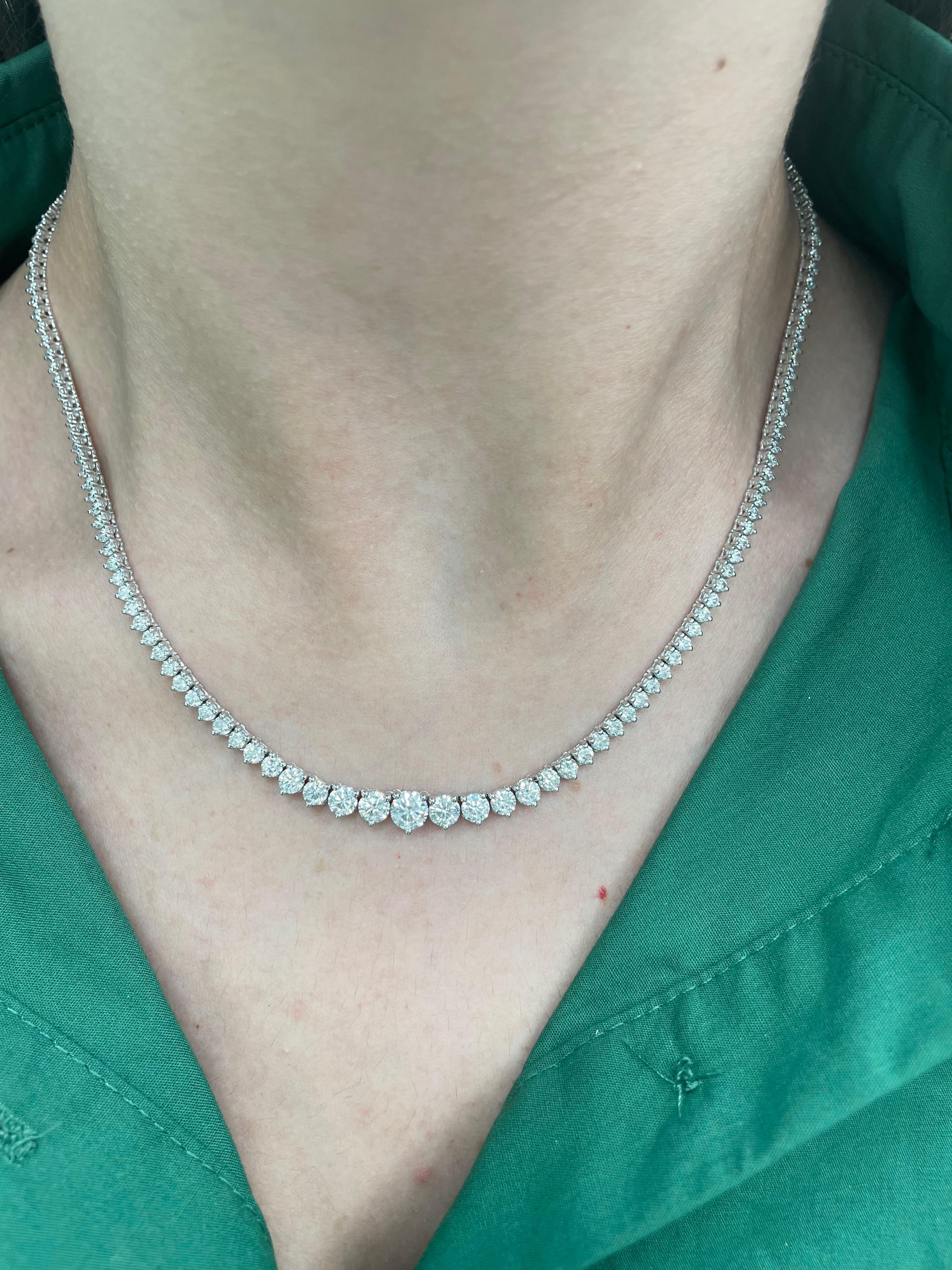 Beautiful and classic diamond tennis riviera necklace, by Alexander Beverly Hills.
9.89 carats of round brilliant diamonds, approximately G/H color and VS2/SI1 clarity. 14k white gold, 20.88 grams, three prong set, 17n.
Accommodated with an