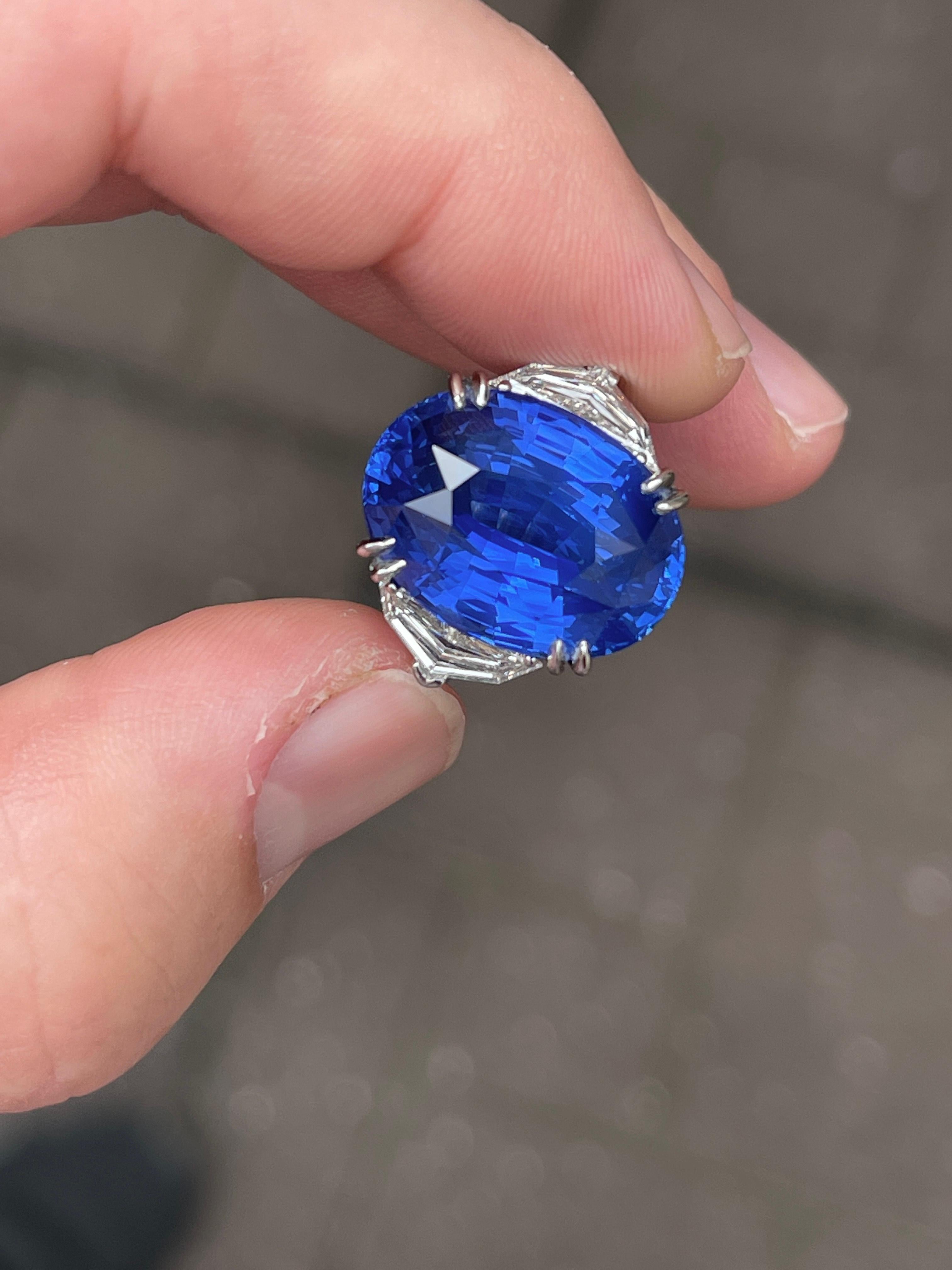 Important modern three-stone AGL certified Ceylon sapphire and diamonds ring. Cornflower sapphire of superb color and liveliness with epaulet / cadilac cut diamonds. High jewelry by Alexander Beverly Hills.
19.54 carats total gemstone weight. 
Oval