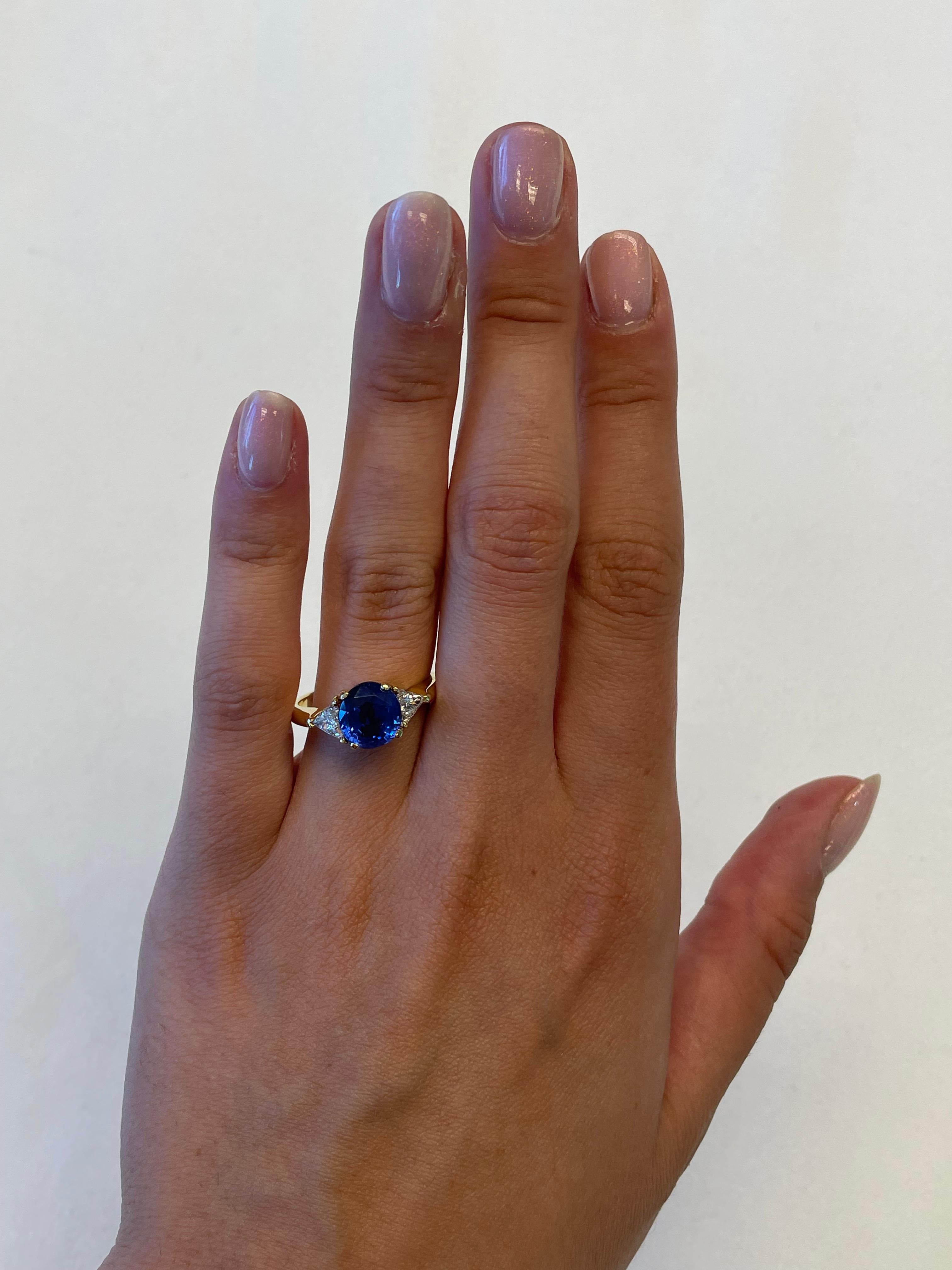 Stunning no heat Burmese sapphire and diamond three stone ring. High jewelry by Alexander Beverly Hills.
3.64 carats total gemstone weight. 
Oval Burmese sapphire, 3.14 carats, no heat, AGL certified. Complimented with 2 trilliant cut diamonds, 0.50