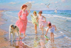 A Mother and Daughters Walking on the Beach with a Borzoi