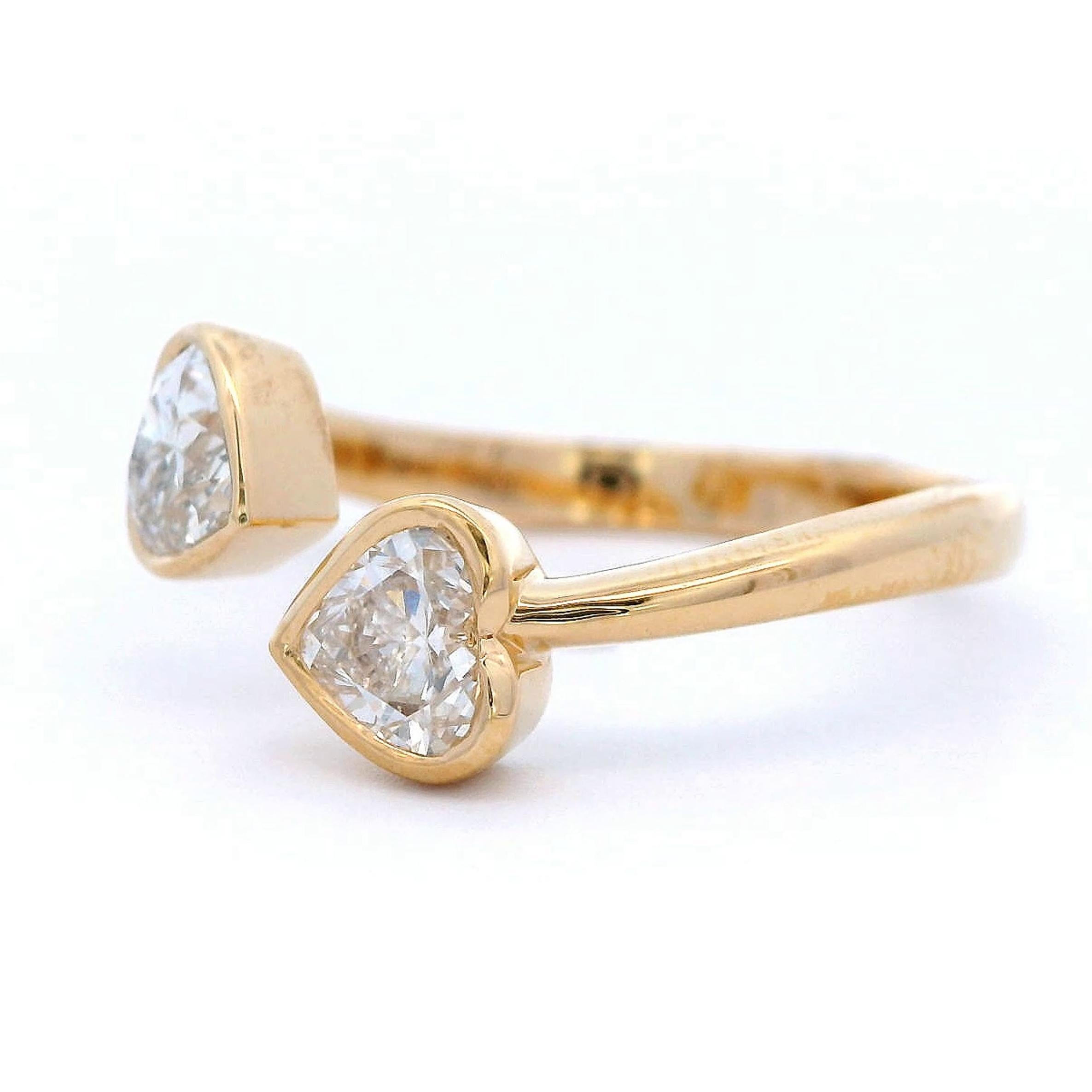 Stunning modern floating diamond open shank toi et moi ring, by Alexander Beverly Hills.
2 heart shape diamonds, 0.79 carats. Approximately F/G color grade and SI clarity grade. 18-karat yellow gold, 3.23 grams, current ring size 6.25.
Accommodated